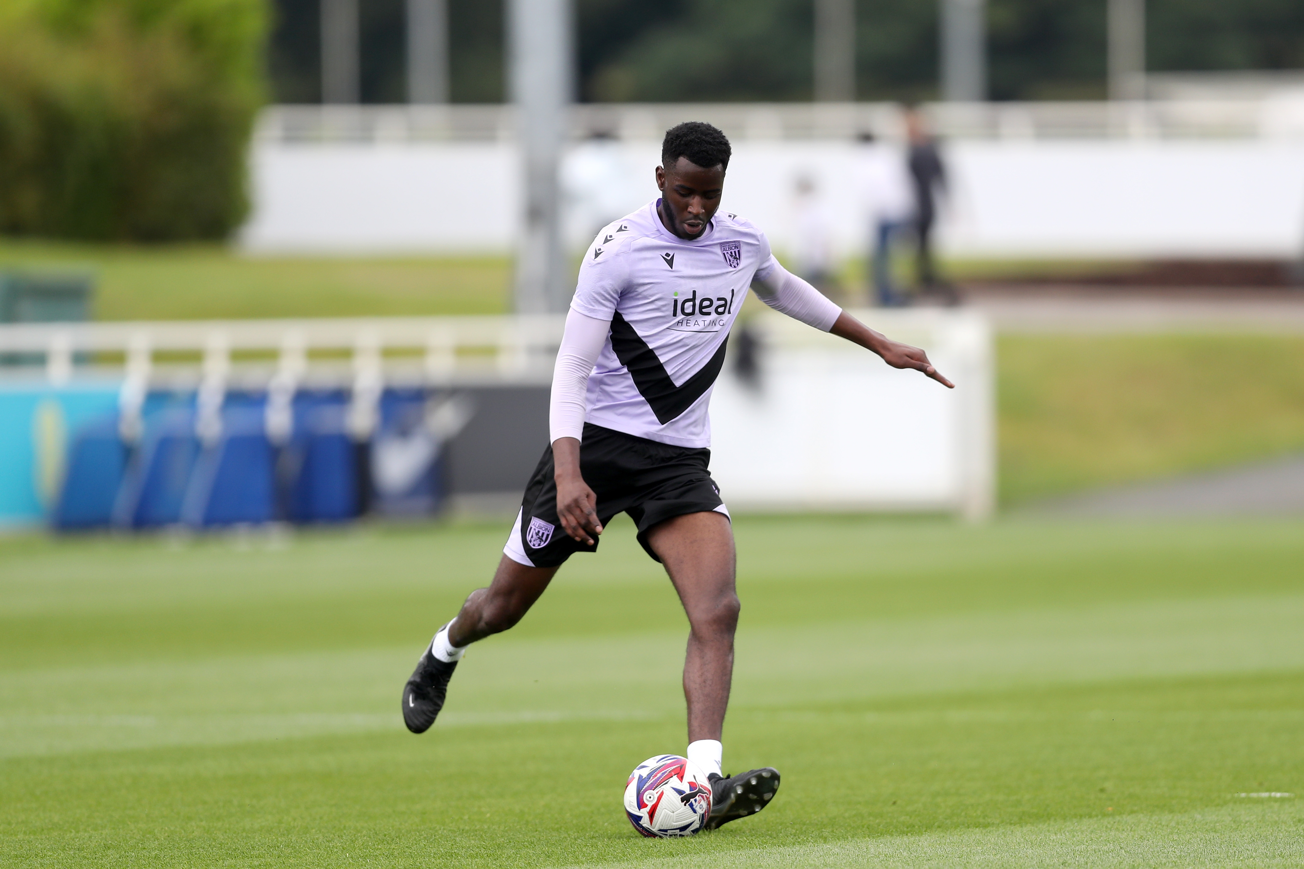 Mo Faal on the ball during training at St. George's Park