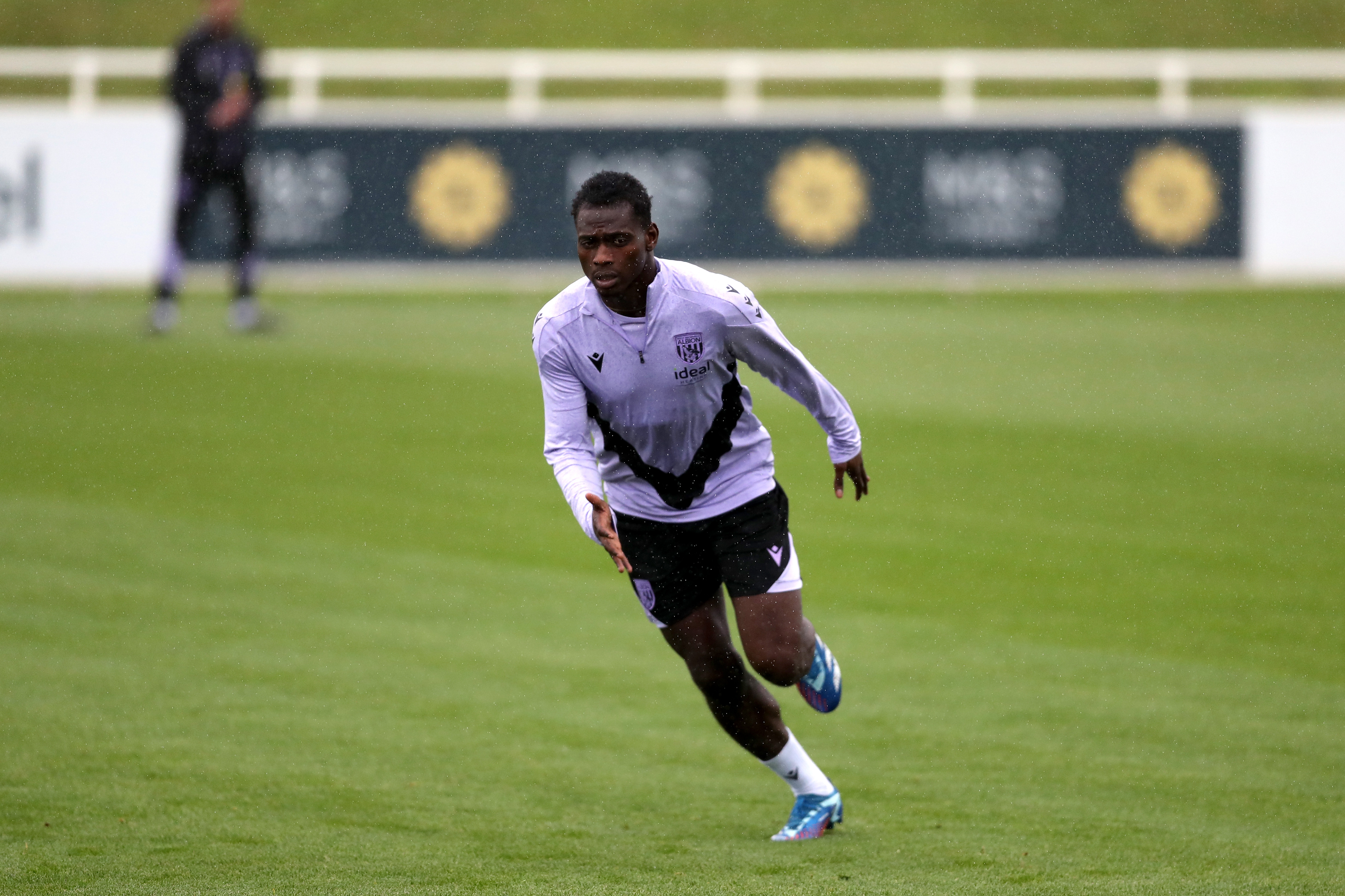 Ousmane Diakité running forwards during a training session at St. George's Park