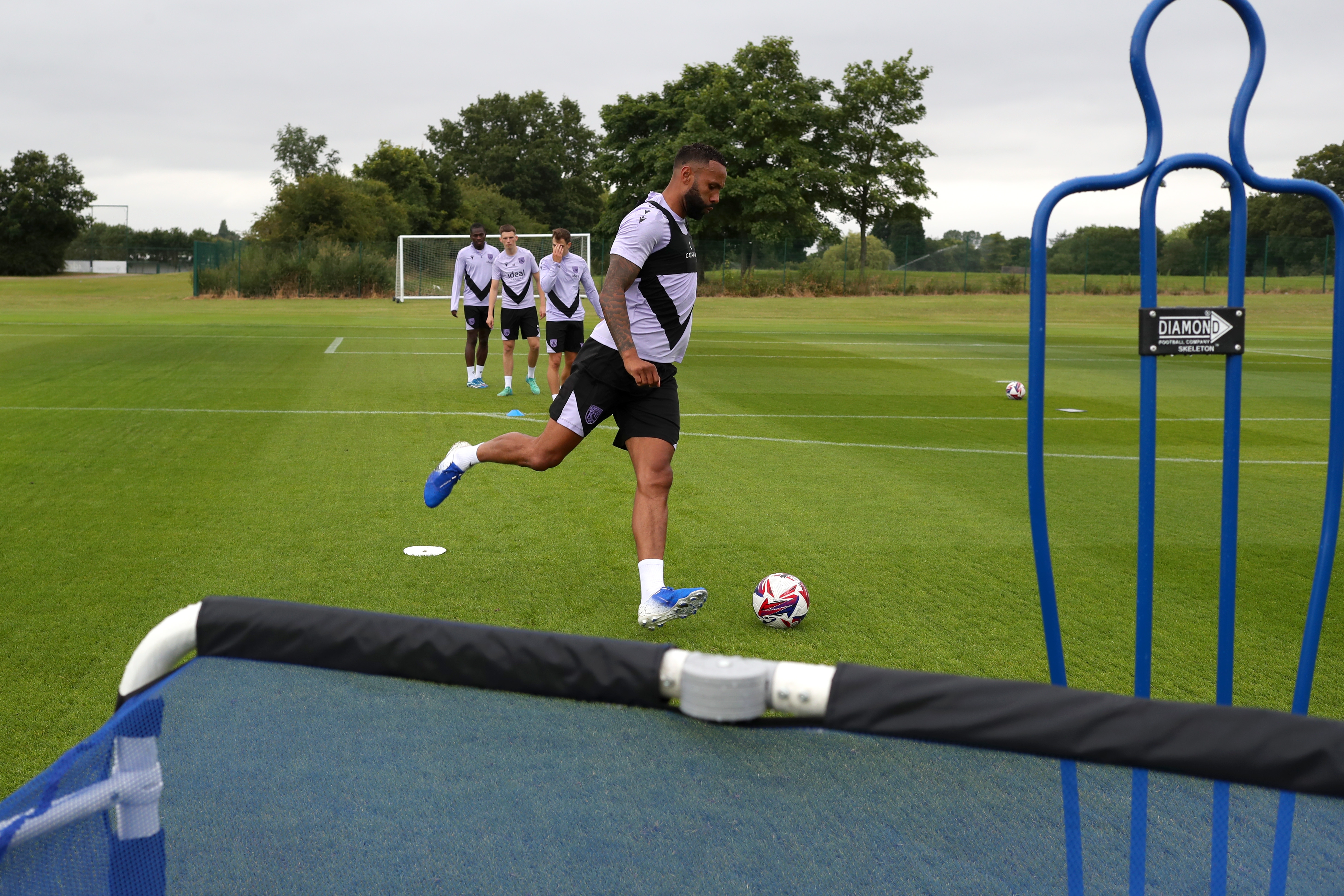 Kyle Bartley passing a ball during a training session 