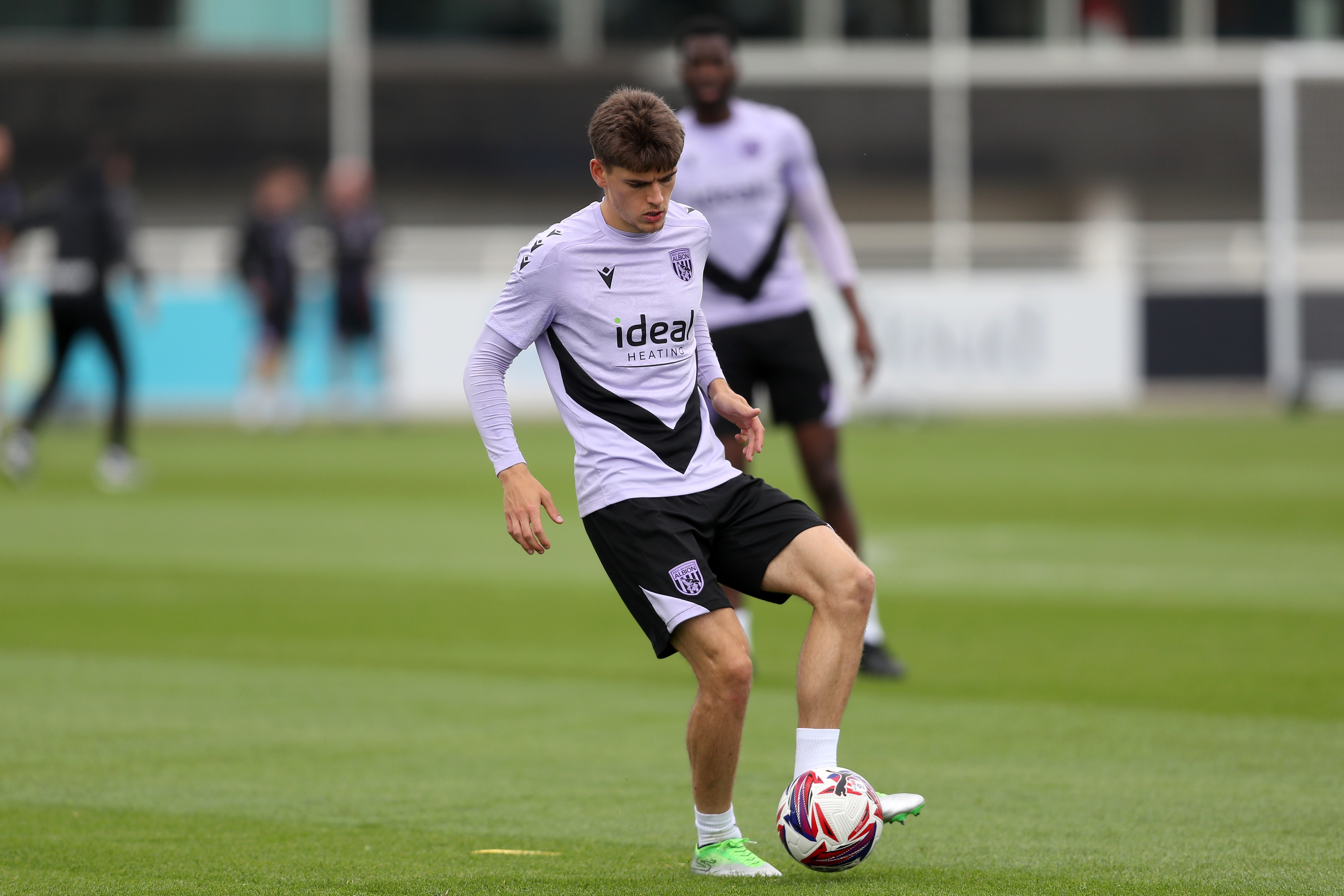 Tom Fellows on the ball during training at St. George's Park