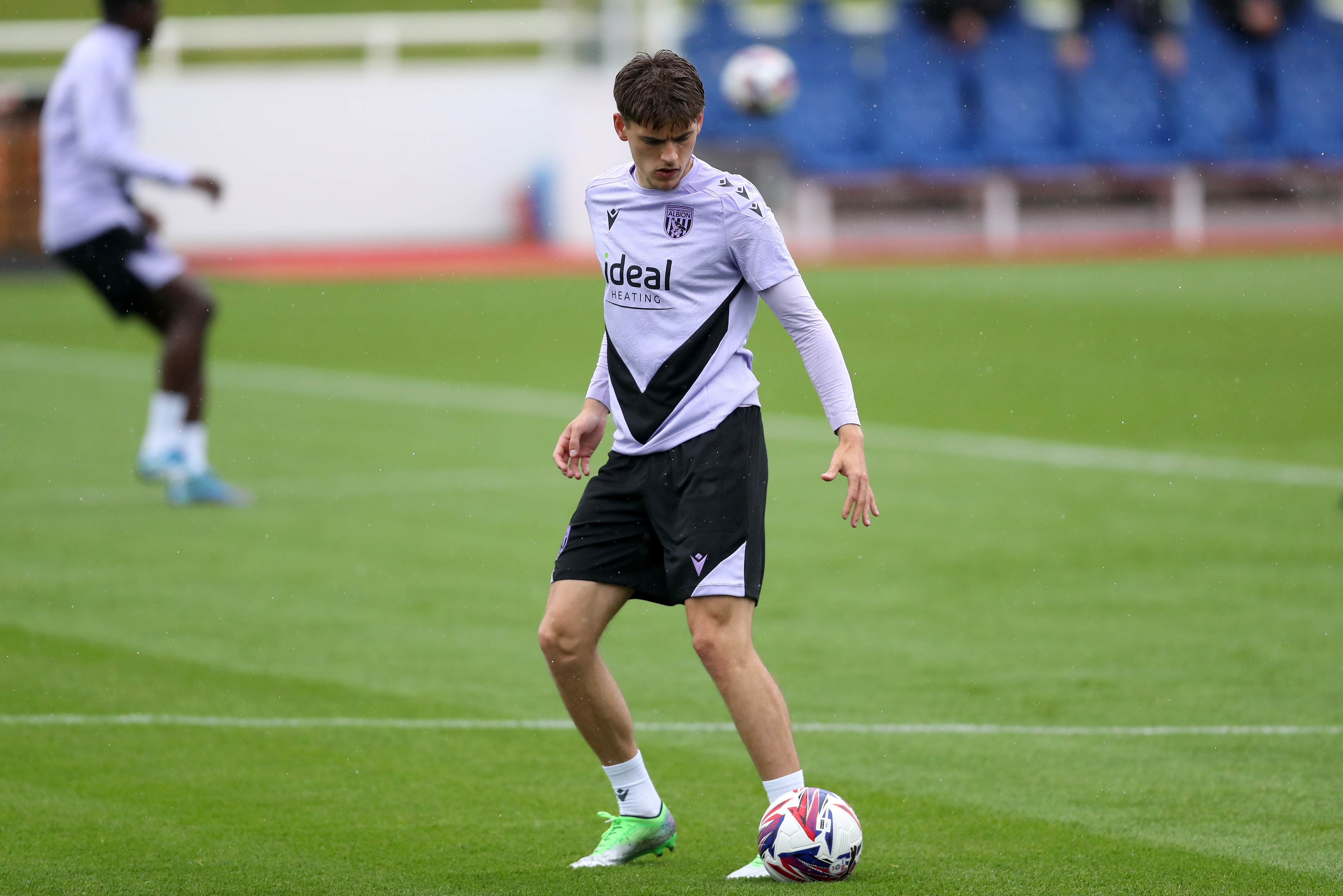 Tom Fellows on the ball during a training session at St. George's Park