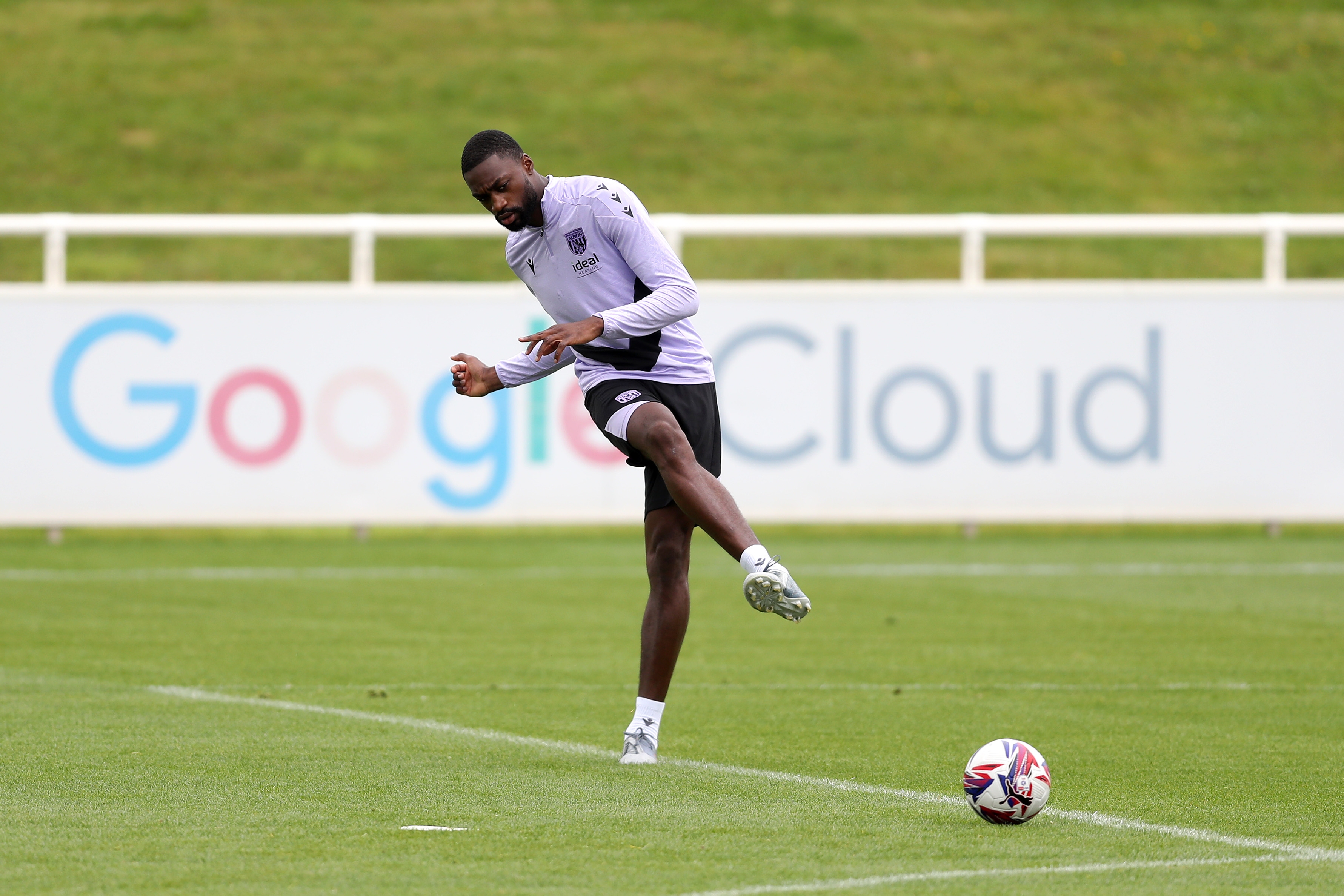 Semi Ajayi passing a ball during a training session at St. George's Park