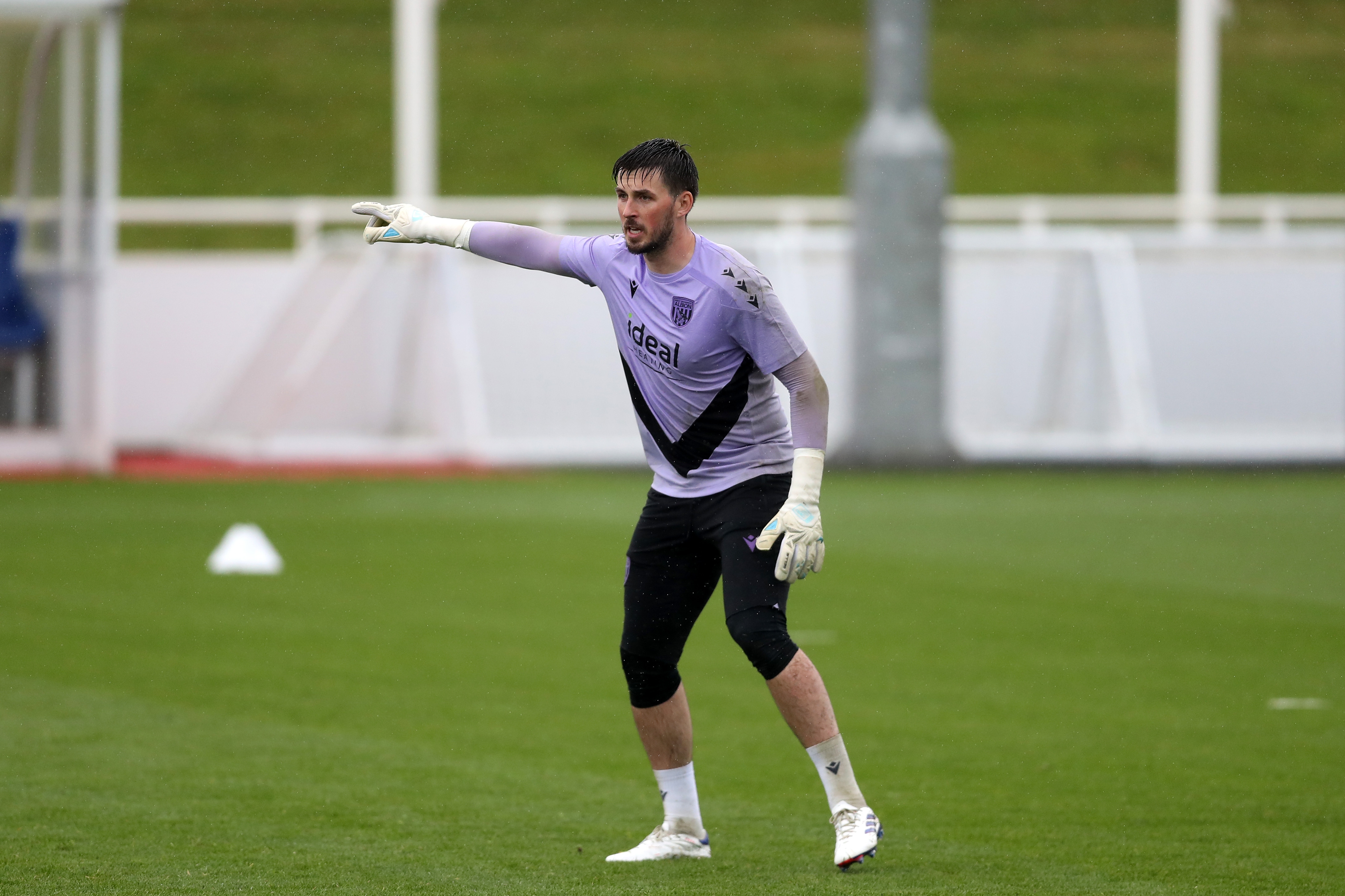 Joe Wildsmith pointing to his right during a training session at St. George's Park