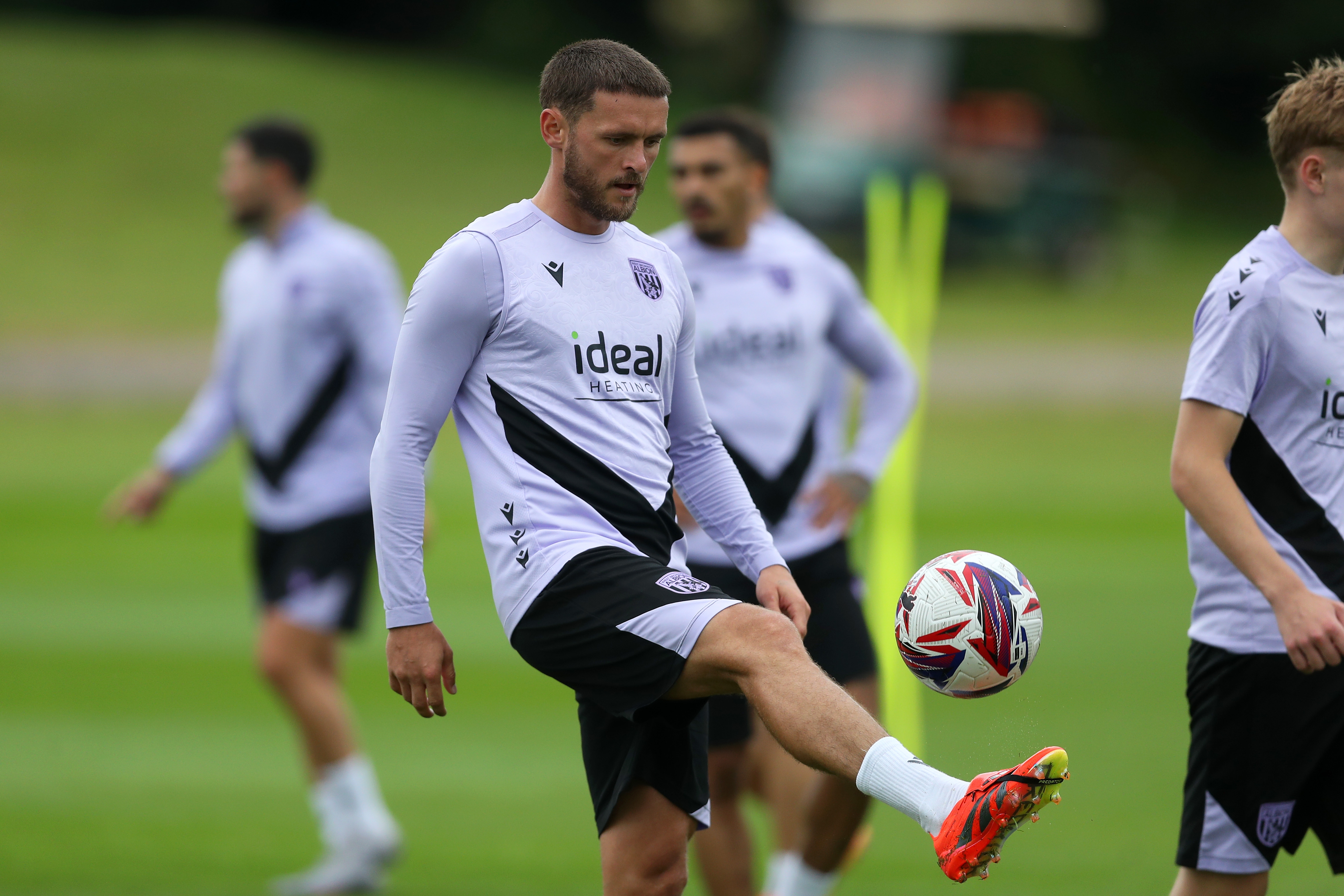John Swift controlling a ball during a training session 