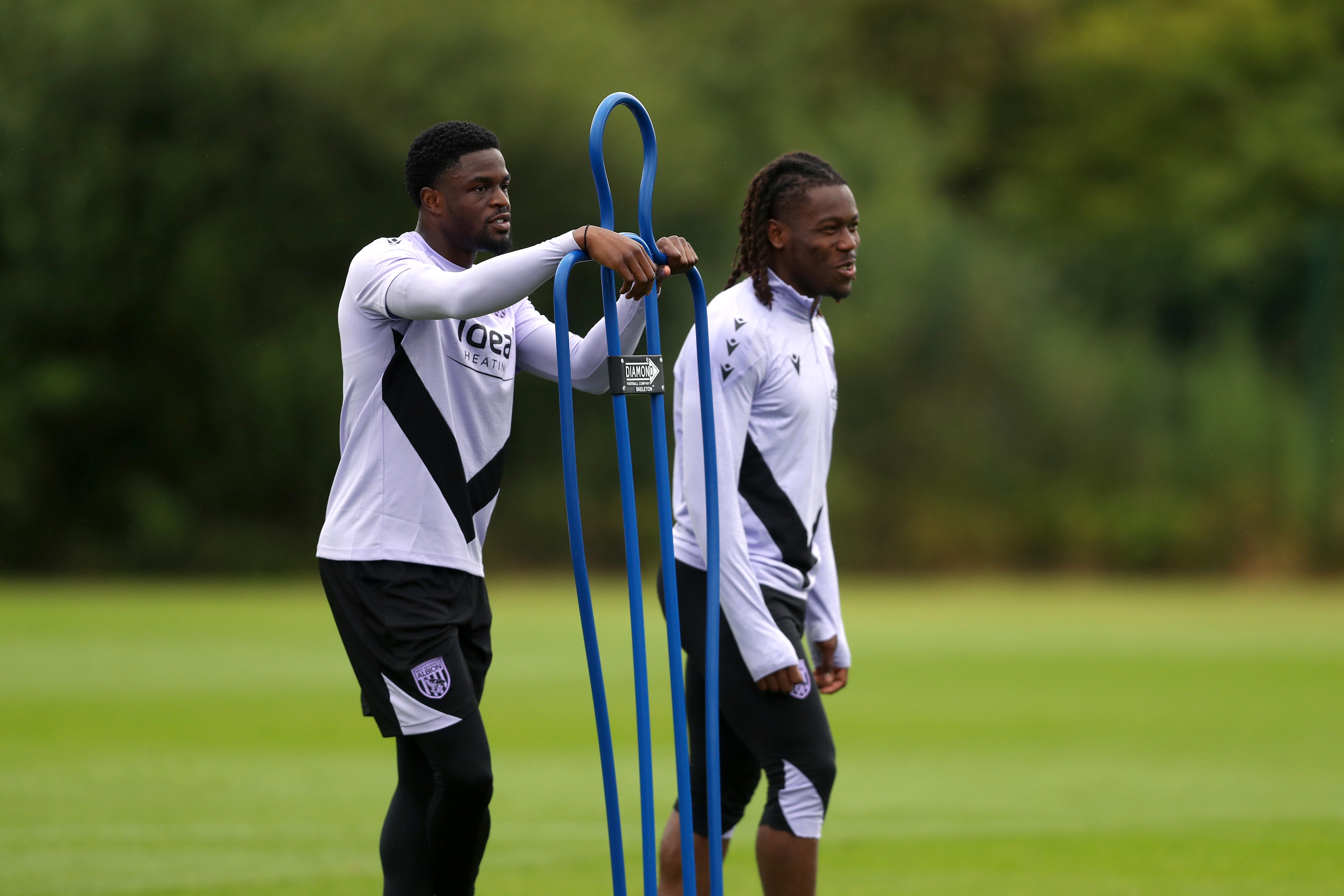 Josh Maja and Brandon Thomas-Asante stood by a mannequin during a training session 