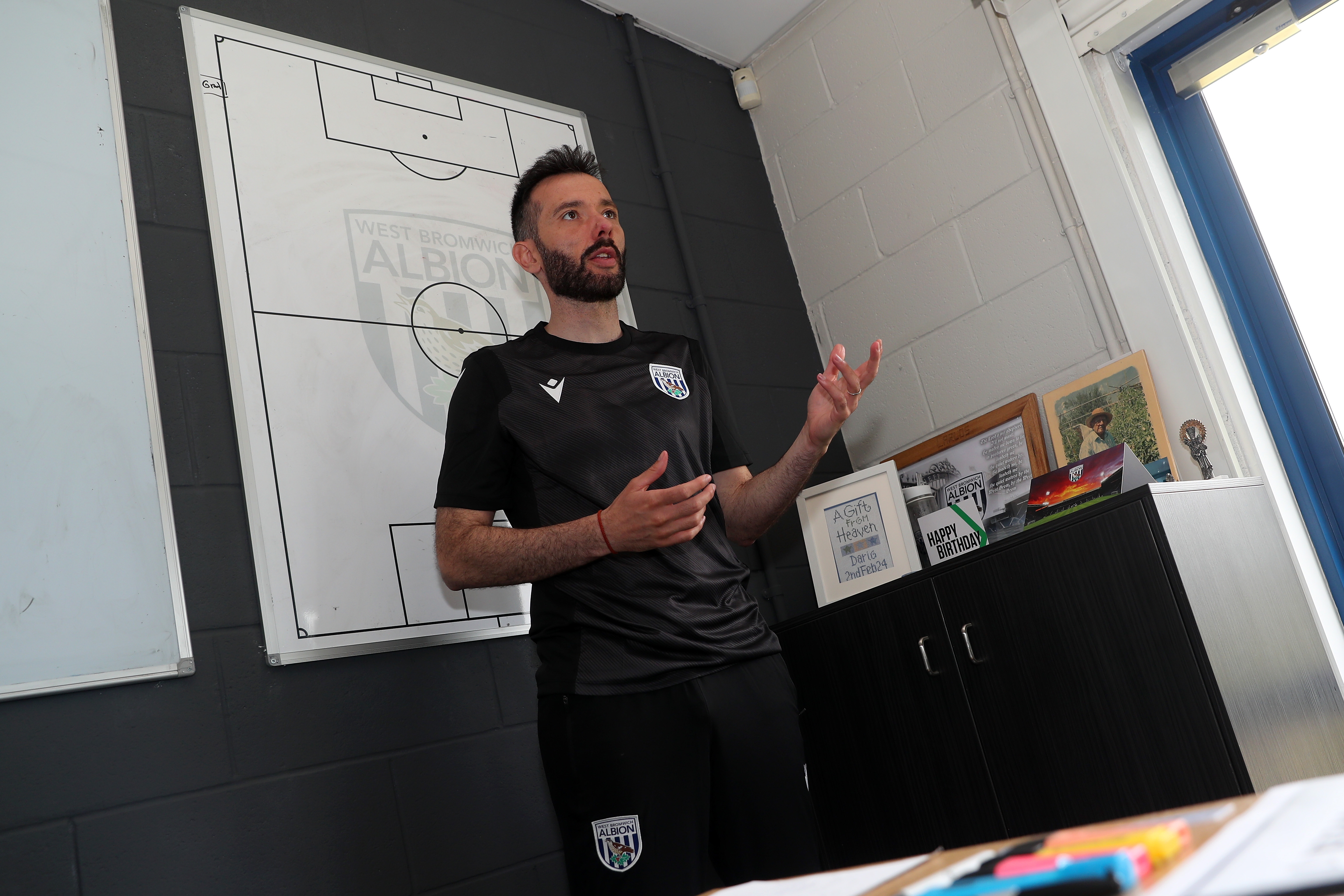 Carlos Corberán delivering info to his coaching staff in his office at the training ground 