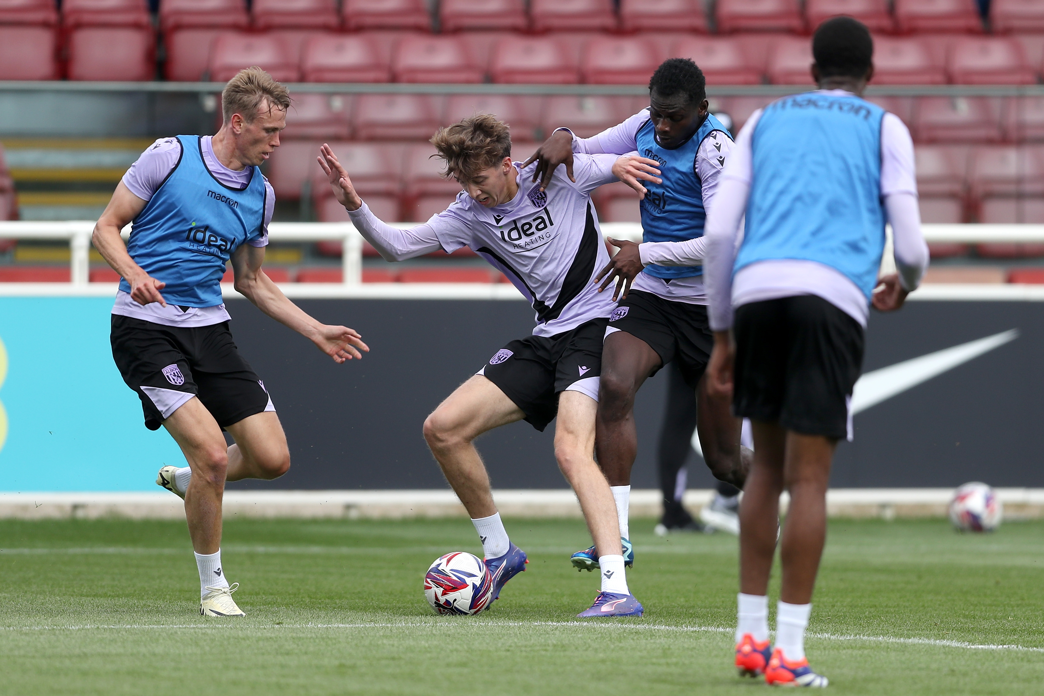 Harry Whitwell, Torbjørn Heggem and Ousmane Diakité battle for the ball during training at St. George's Park 