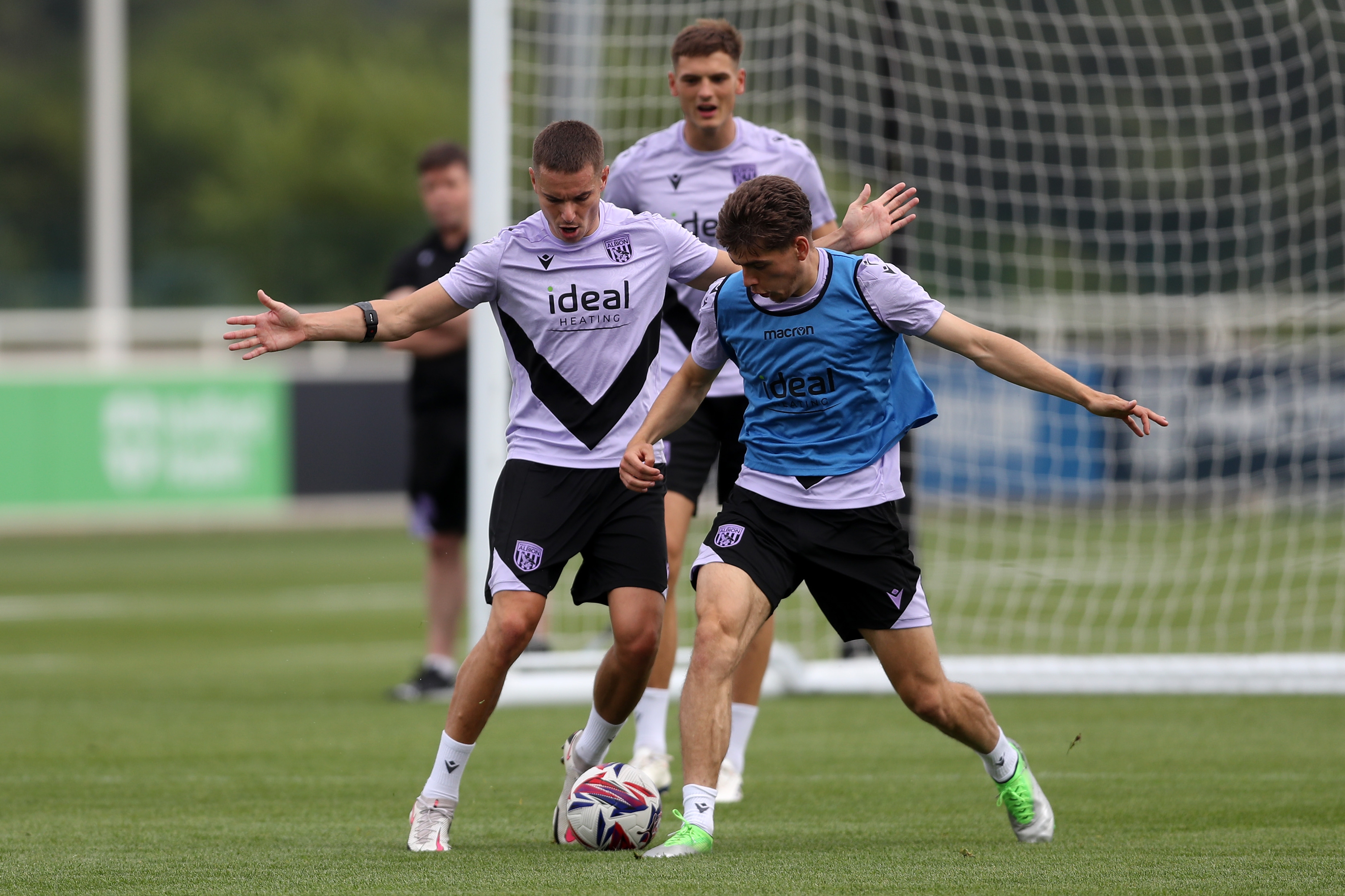 Conor Townsend and Tom Fellows battle for the ball during training at St. George's Park 