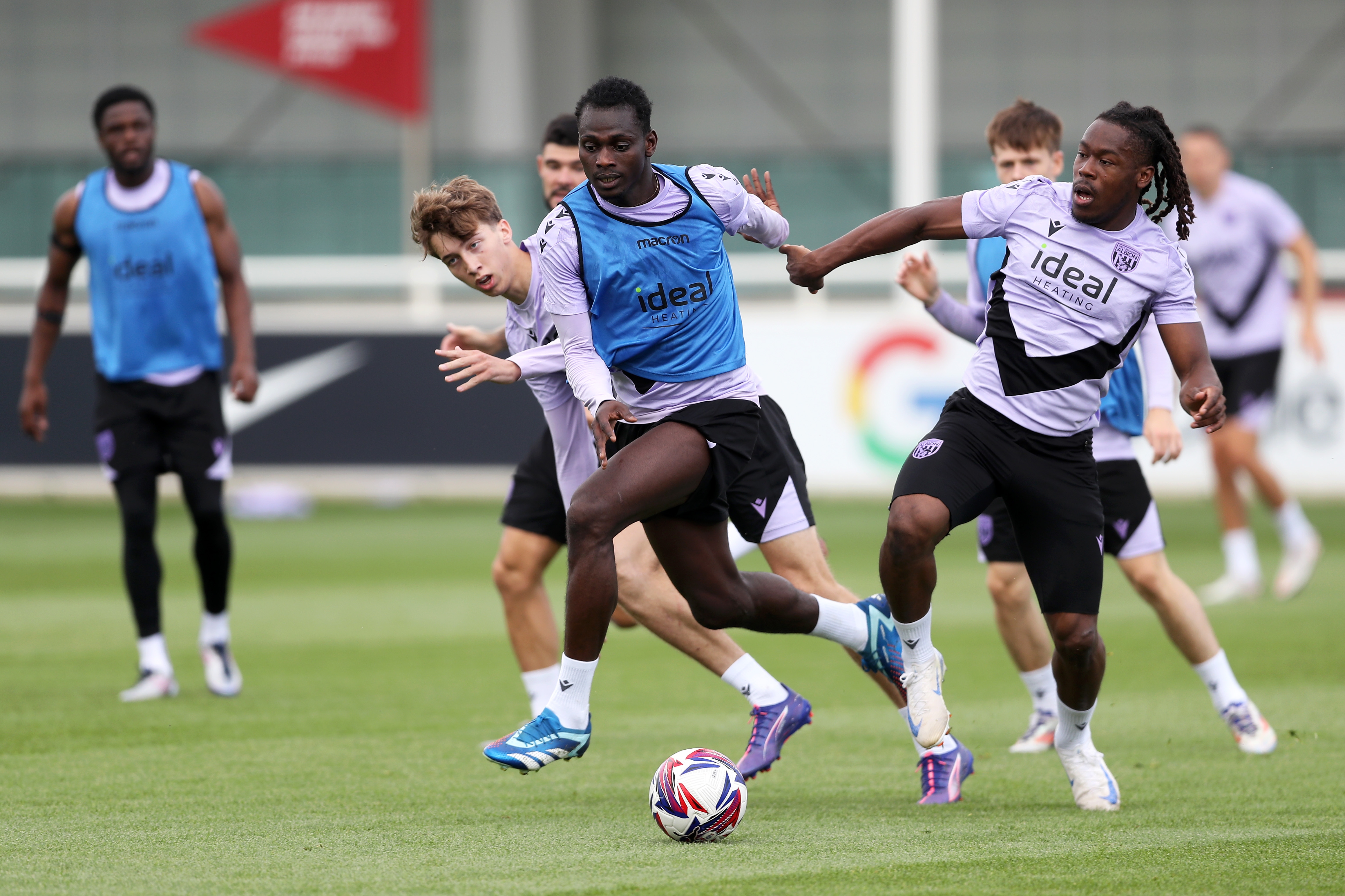 Brandon Thomas-Asante and Ousmane Diakité battle for the ball during training at St. George's Park 