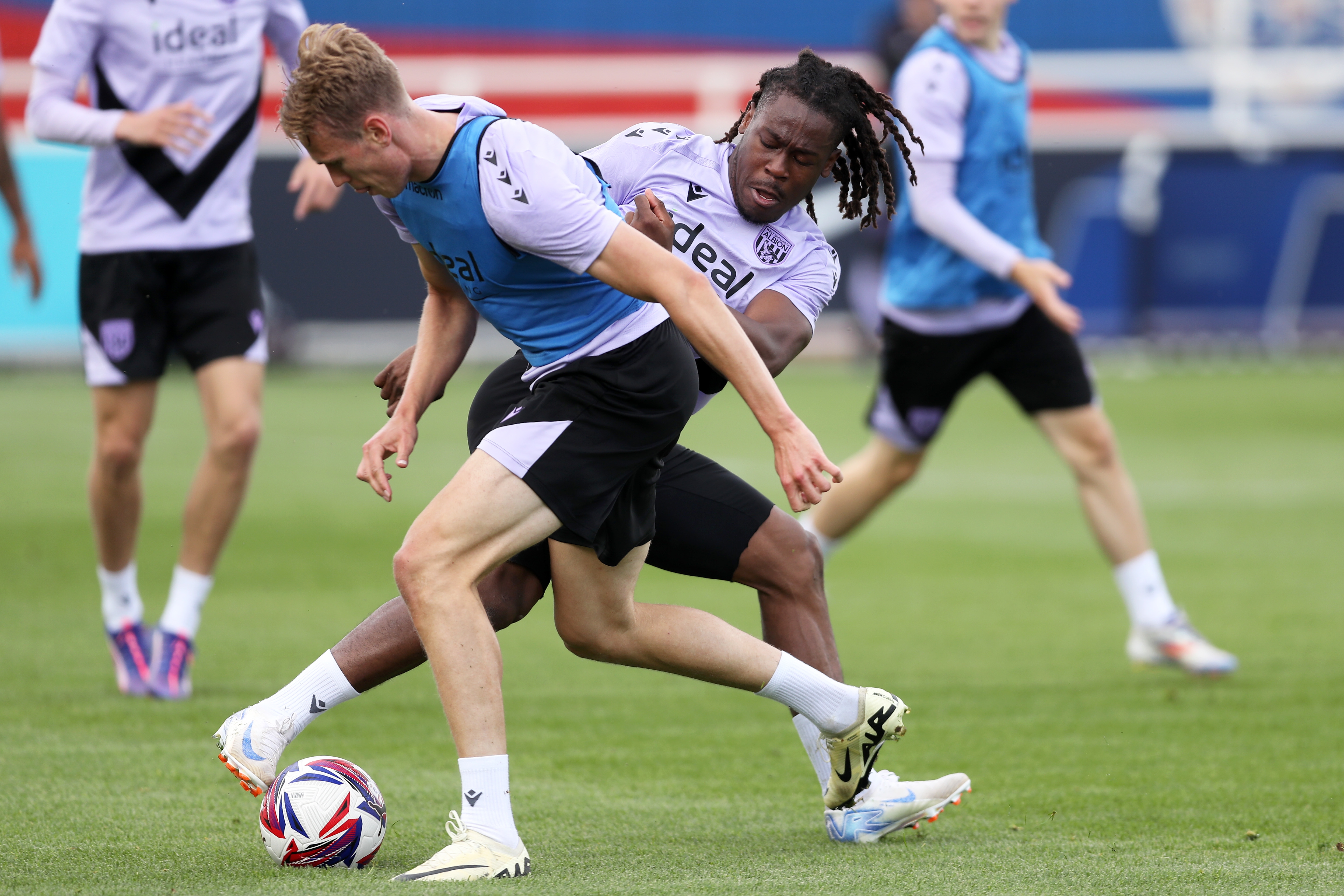 Brandon Thomas-Asante and Torbjørn Heggem battle for the ball during training at St. George's Park