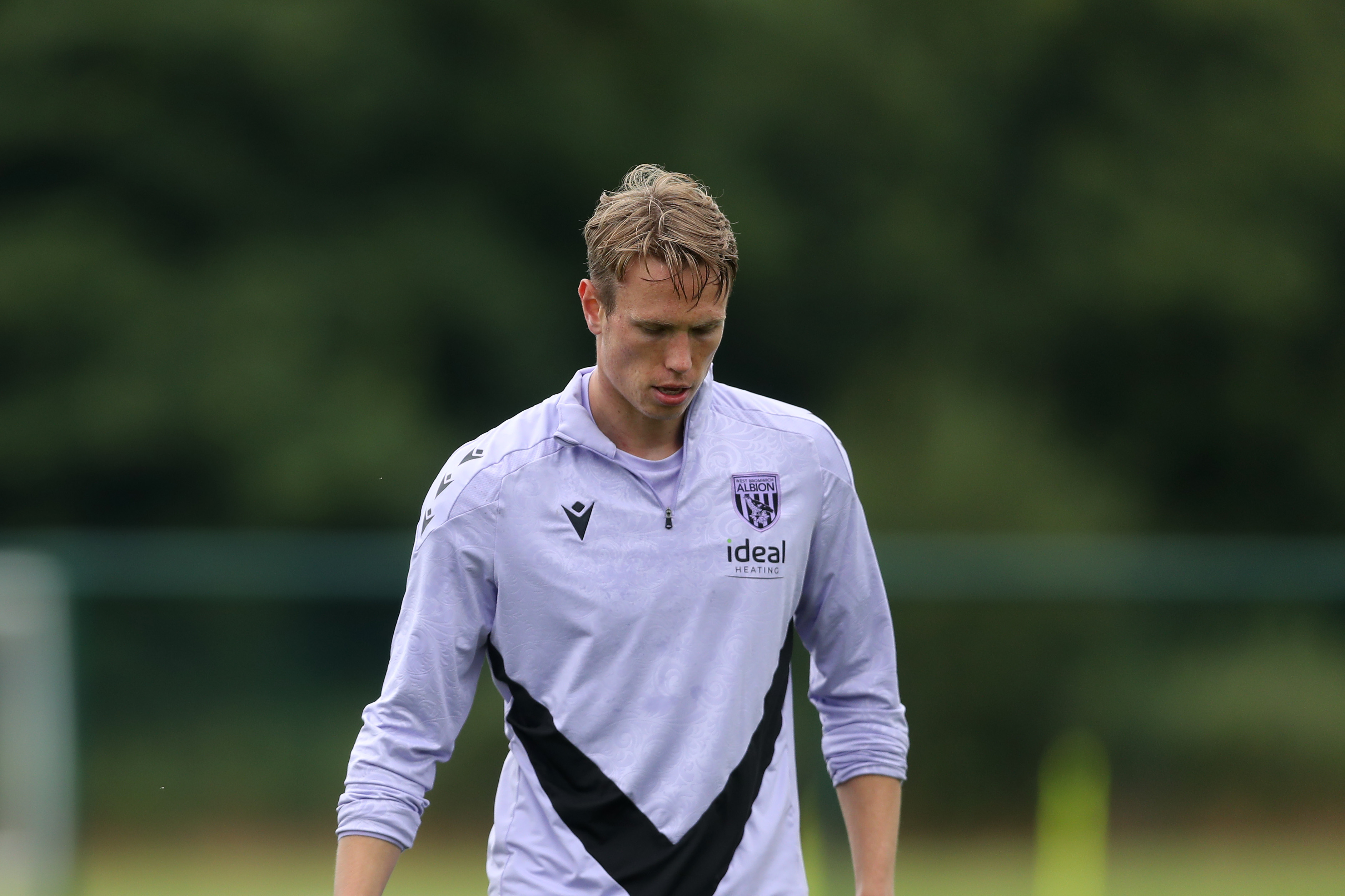 Torbjørn Heggem looking down at the pitch during a training session 