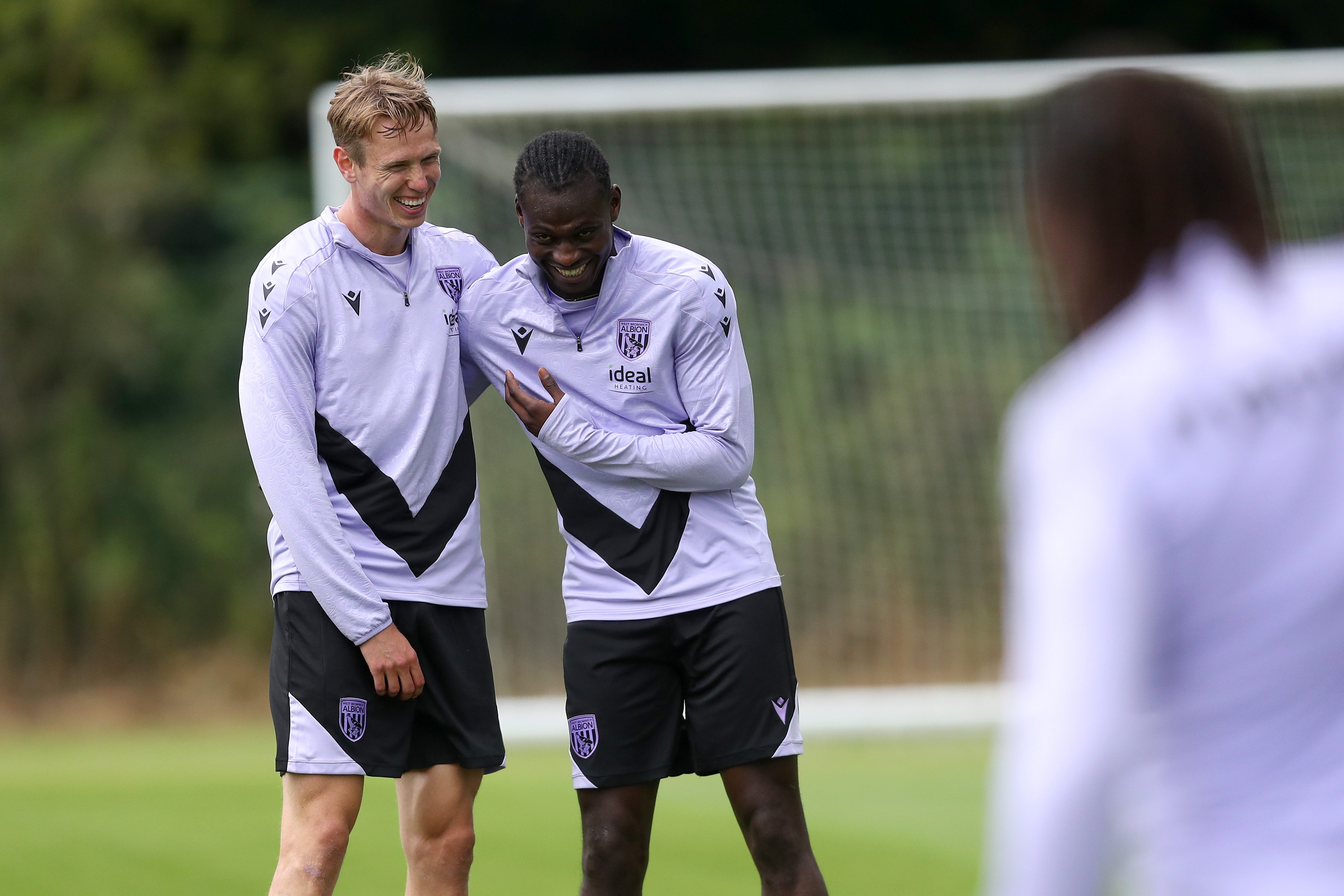 Torbjørn Heggem laughing with Ousmane Diakité during training 