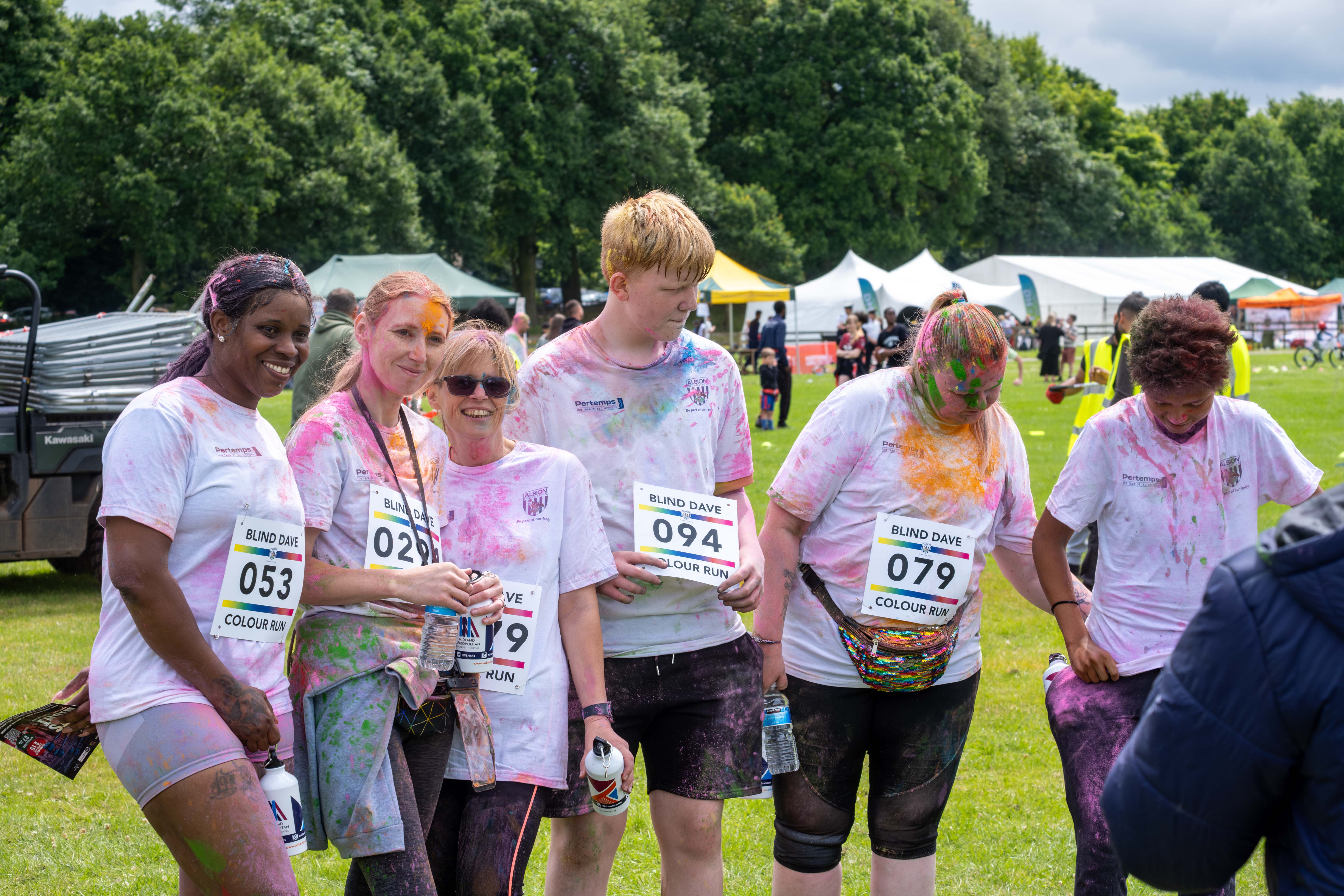 Group of running gathering for a photo