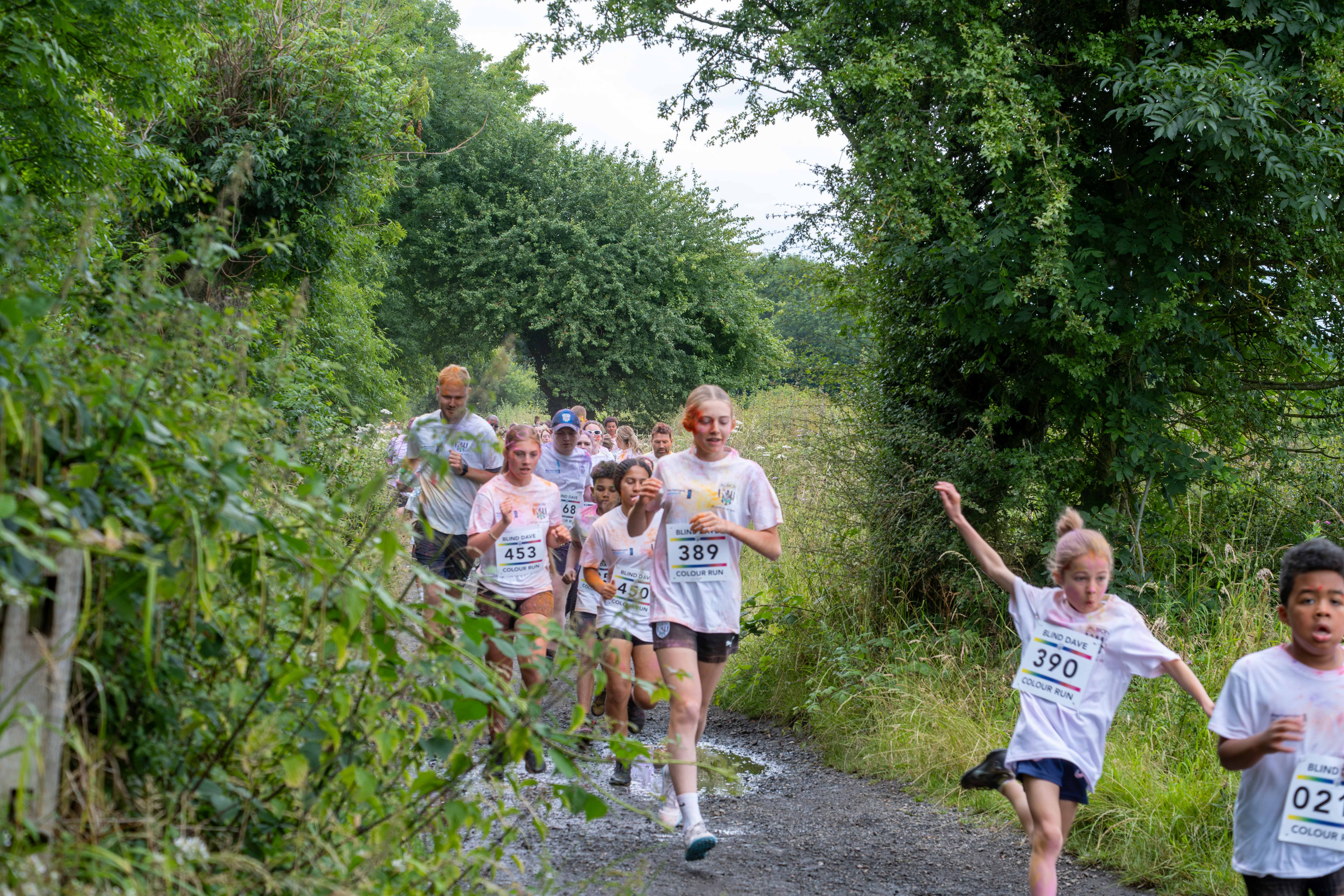 Runners heading through shrubs on Sandwell Valley Park.