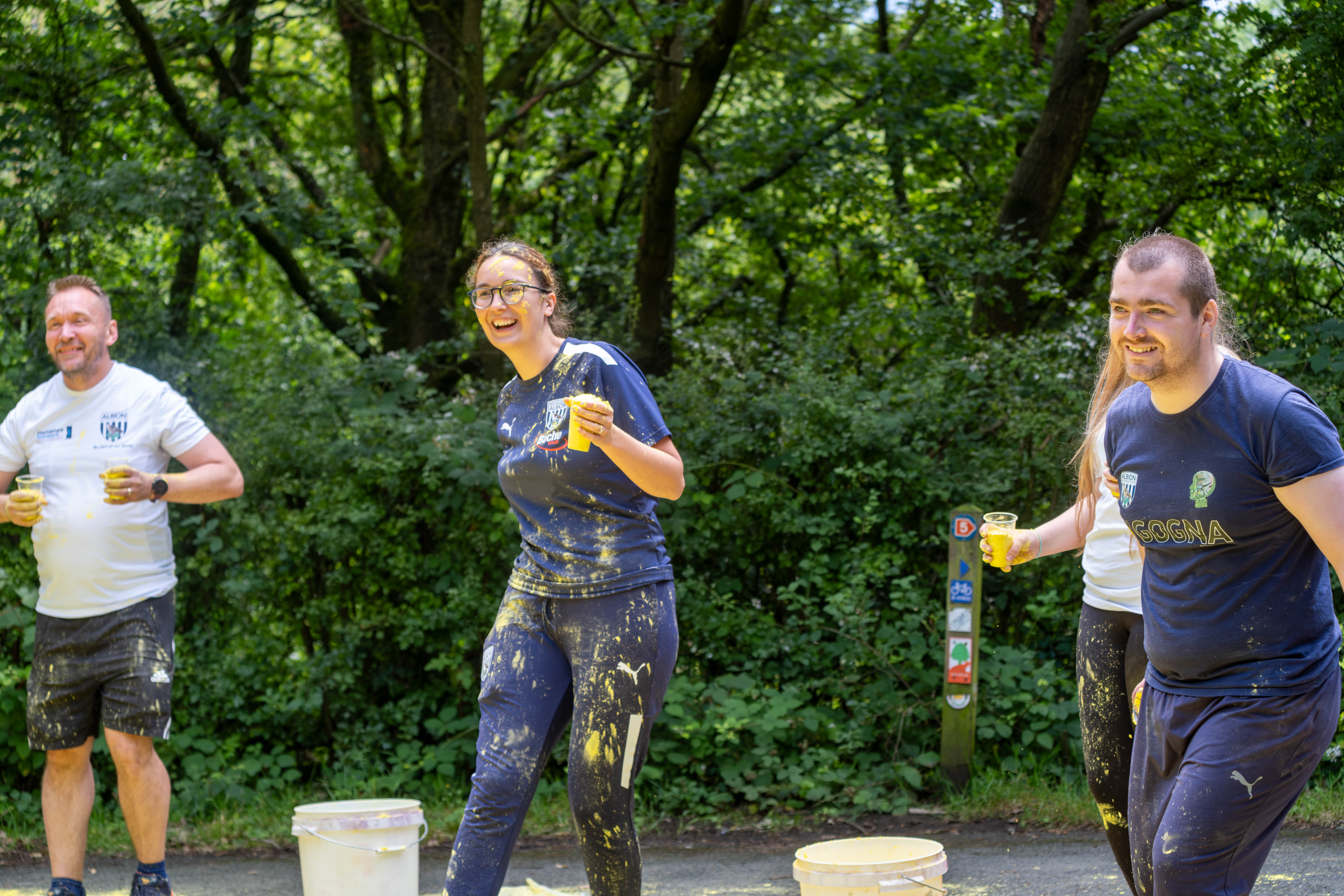 Foundation staff and volunteers at the colour station, ready to throw paint powder.