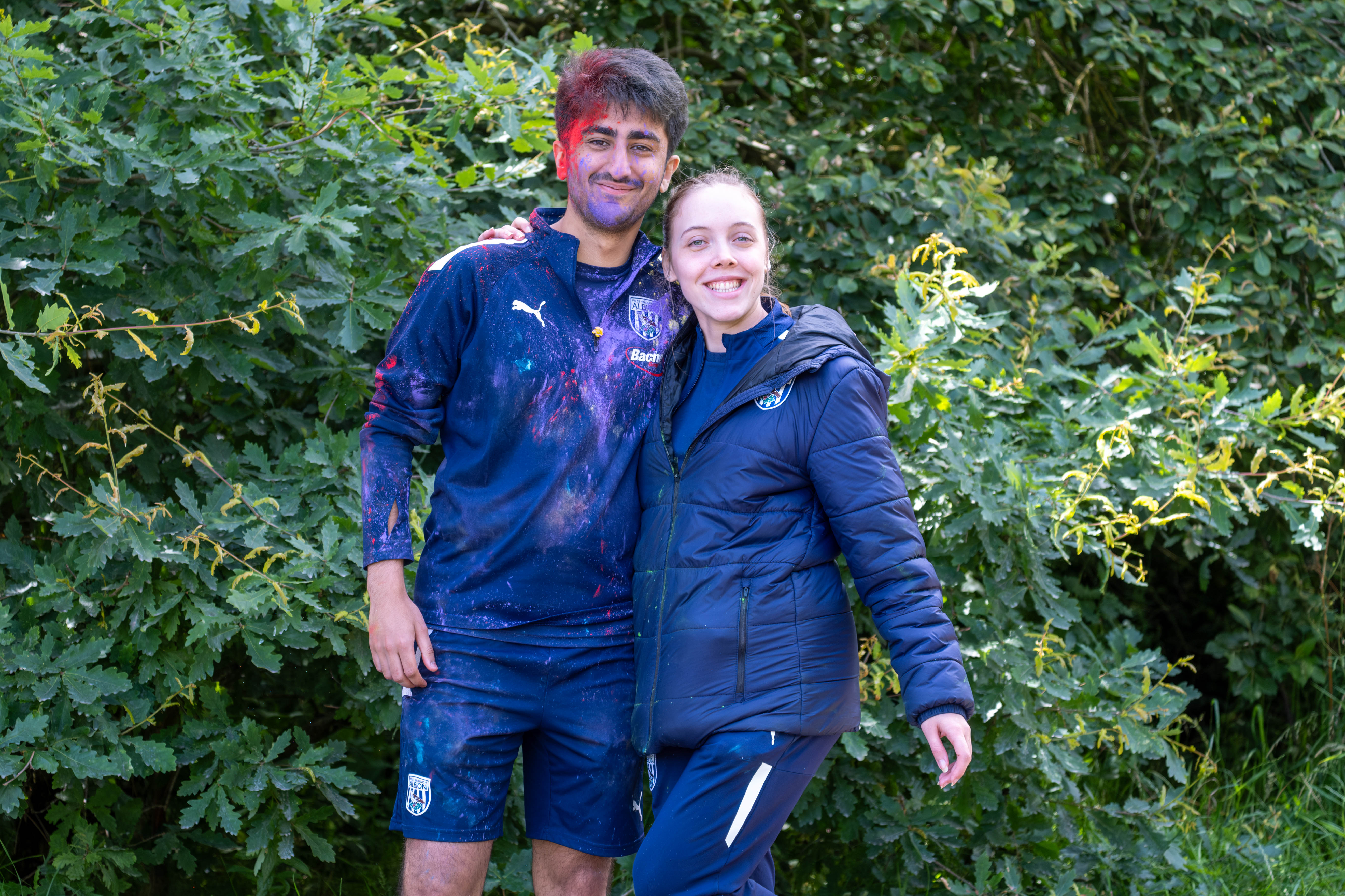 Two Foundation staff member posing for a photo at another colour station.