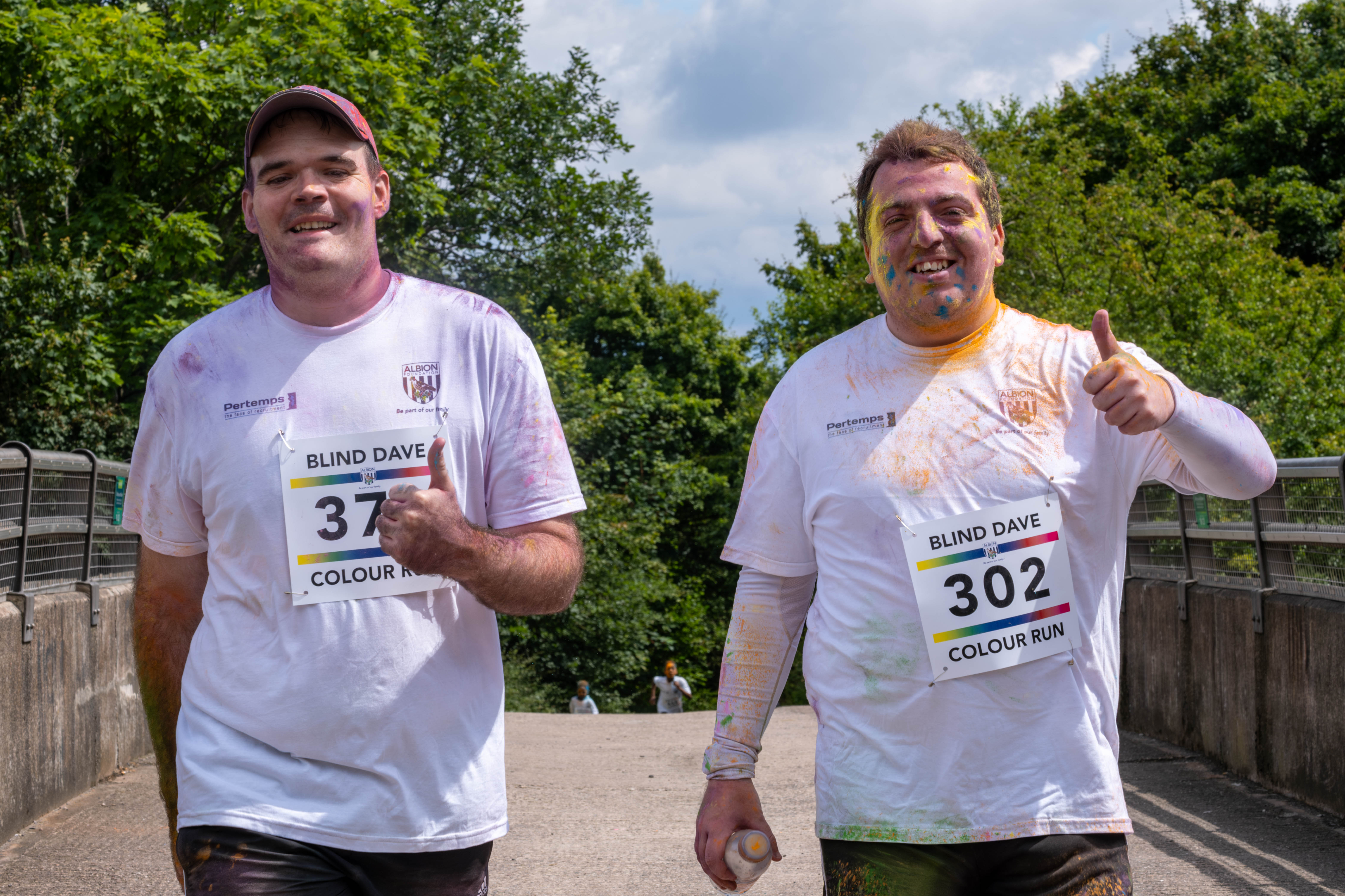 Two participants other giving a thumbs up.