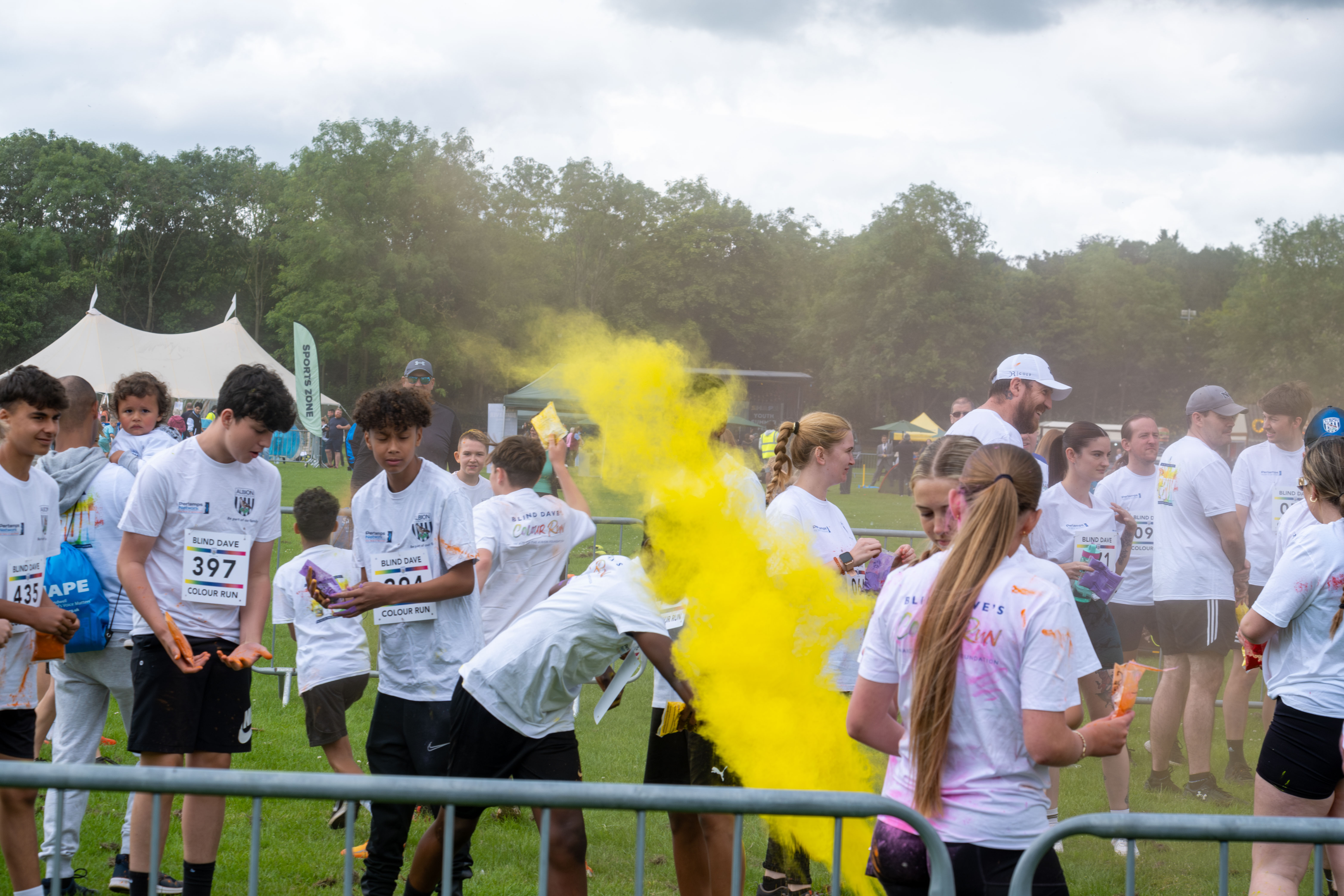 Burst of yellow paint being thrown.