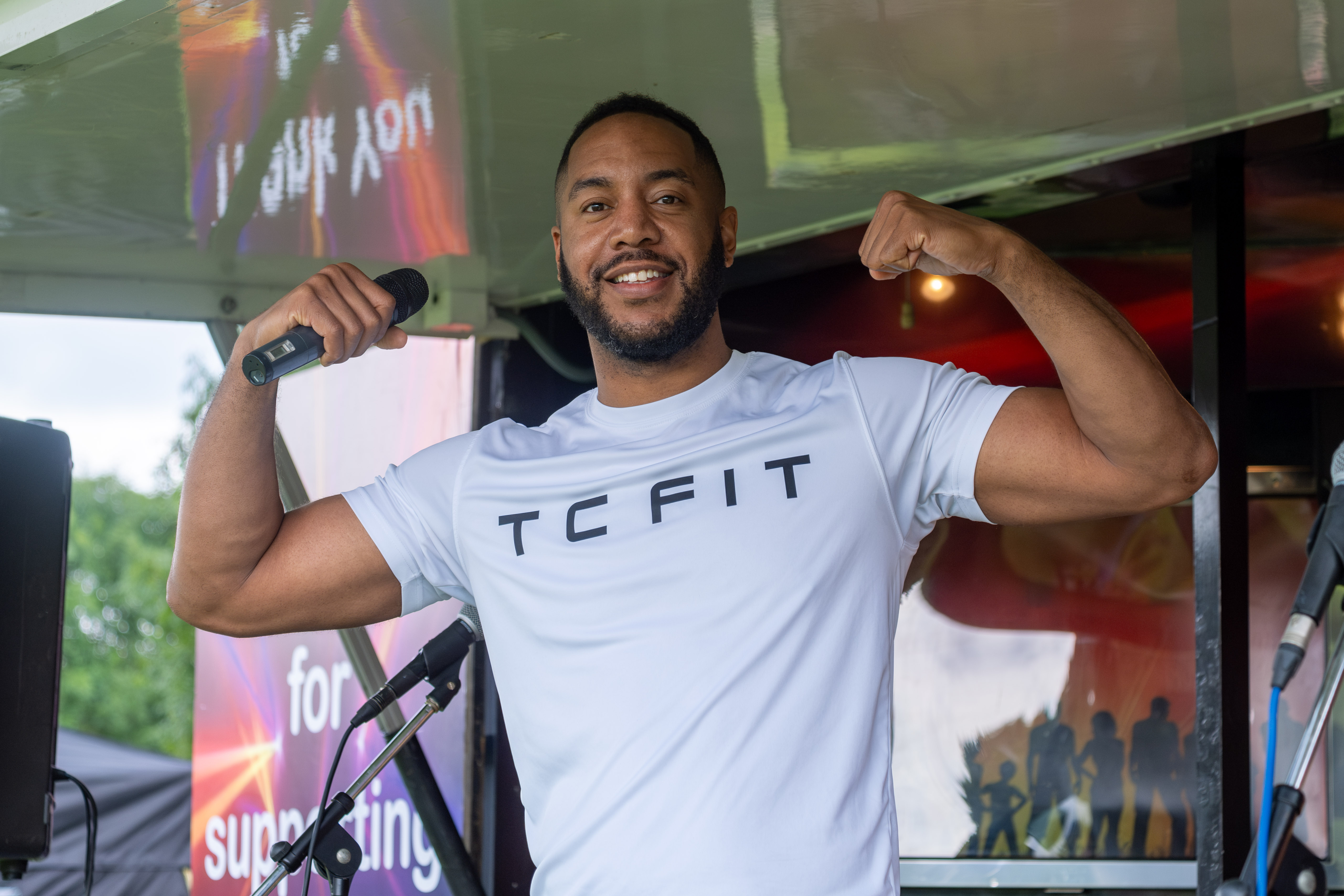 Tony Clark (TC Fit) flexing muscles.