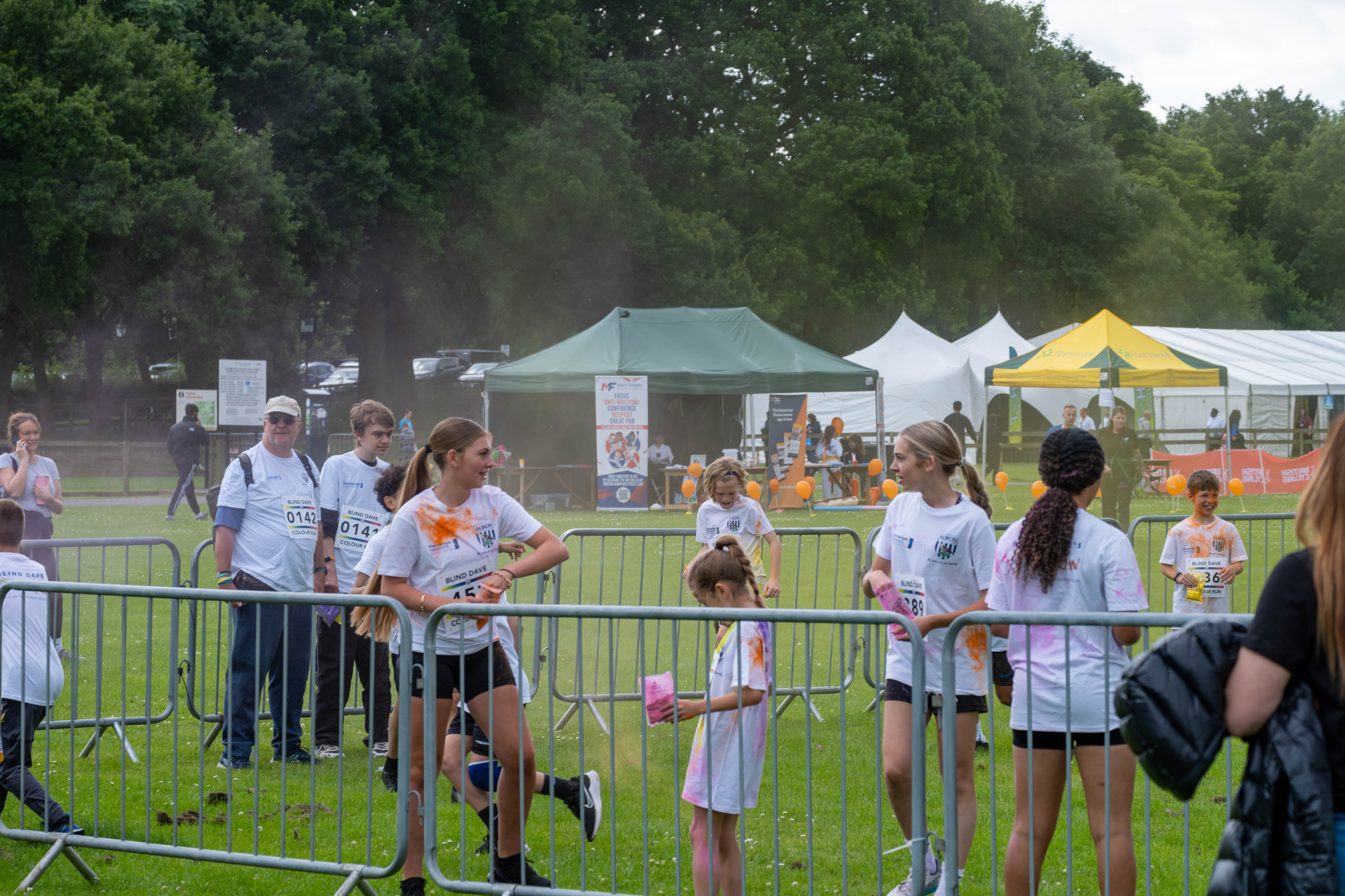 Group of youngster with paint powder.