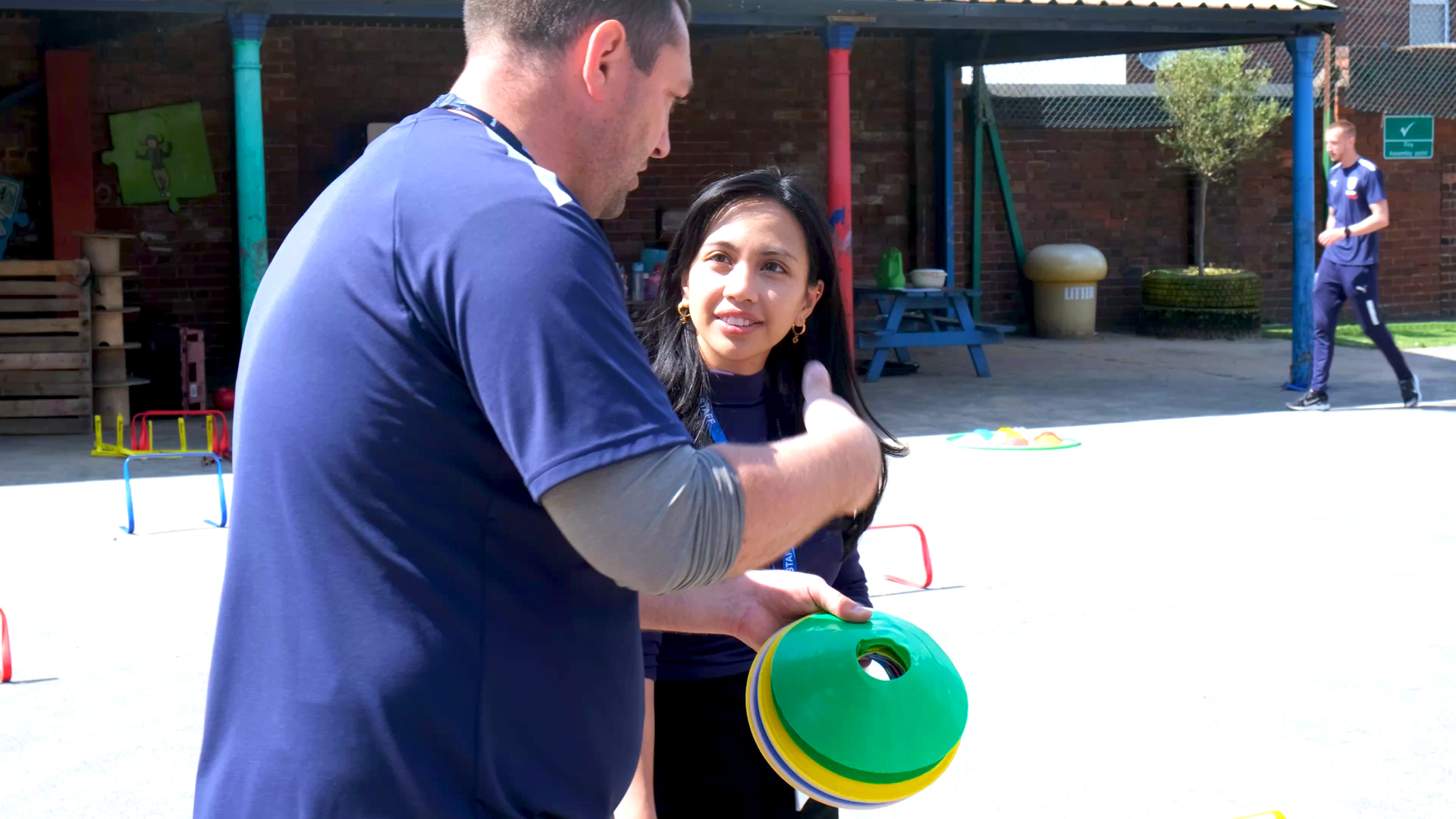 Glenn Short and Miss Mendoza discussing progress of activities.