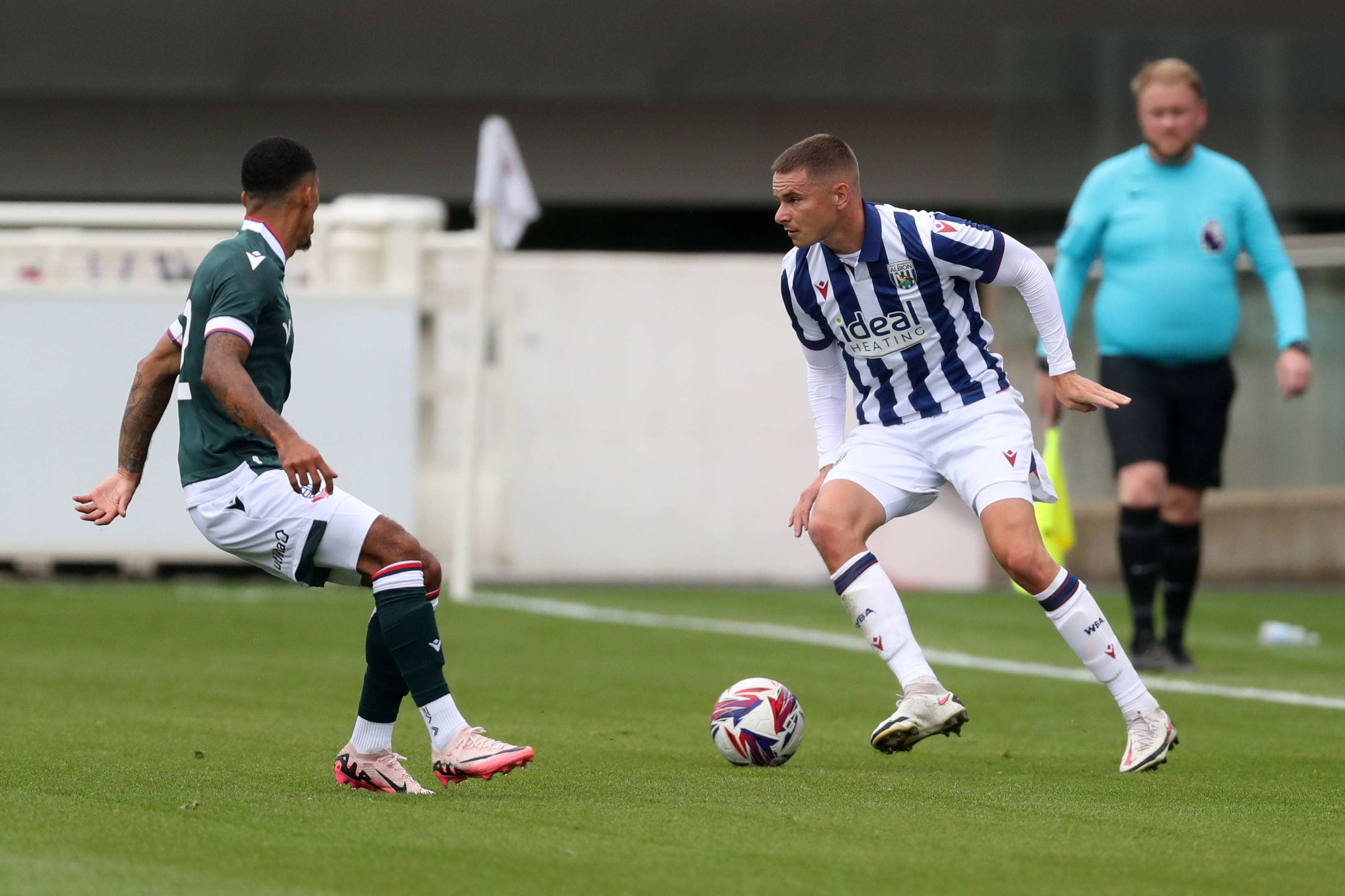 Conor Townsend on the ball during a pre-season friendly against Bolton Wanderers at St George's Park