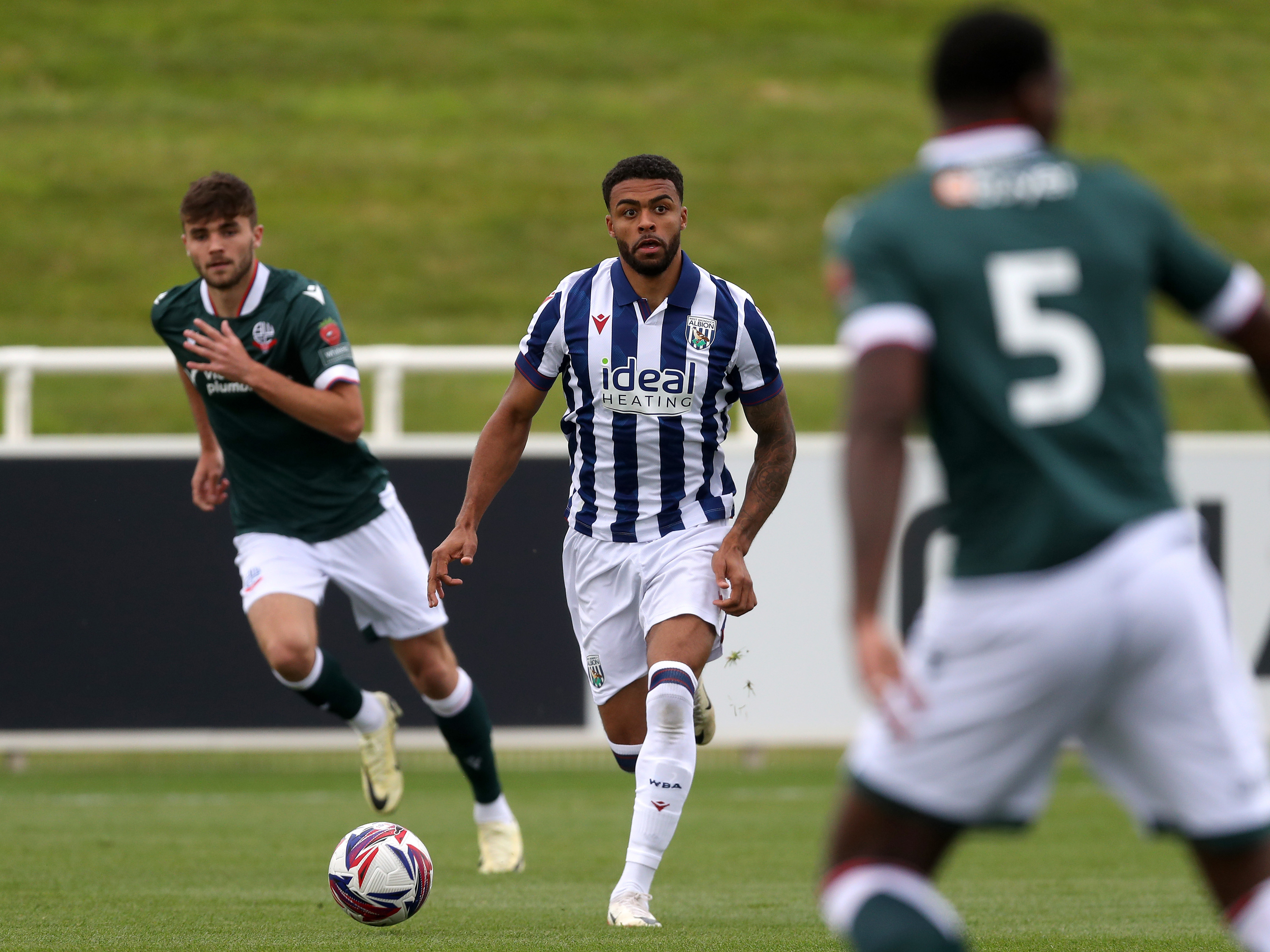 Darnell Furlong running with the ball during a pre-season fixture against Bolton Wanderers at St George's Park