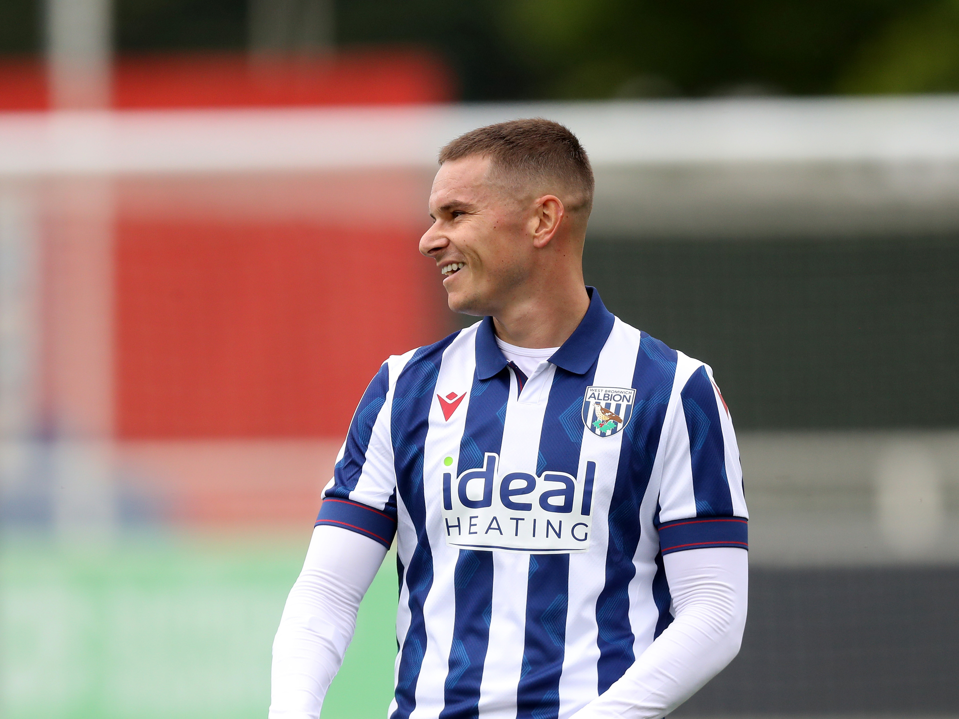 Conor Townsend smiling during a game against Bolton wearing the home kit 