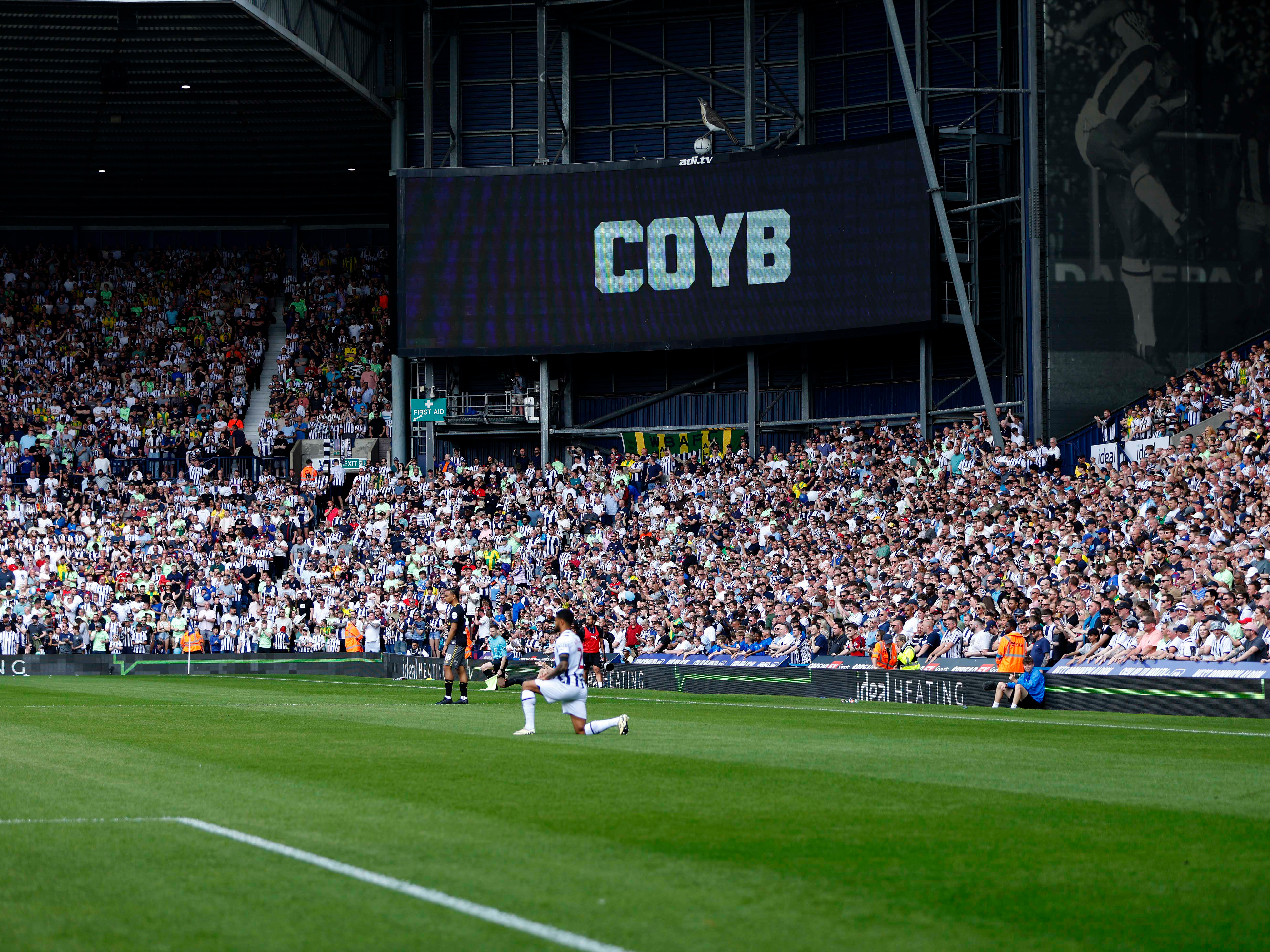 A photo of The Hawthorns with the big screen showing a title - 'COYB'