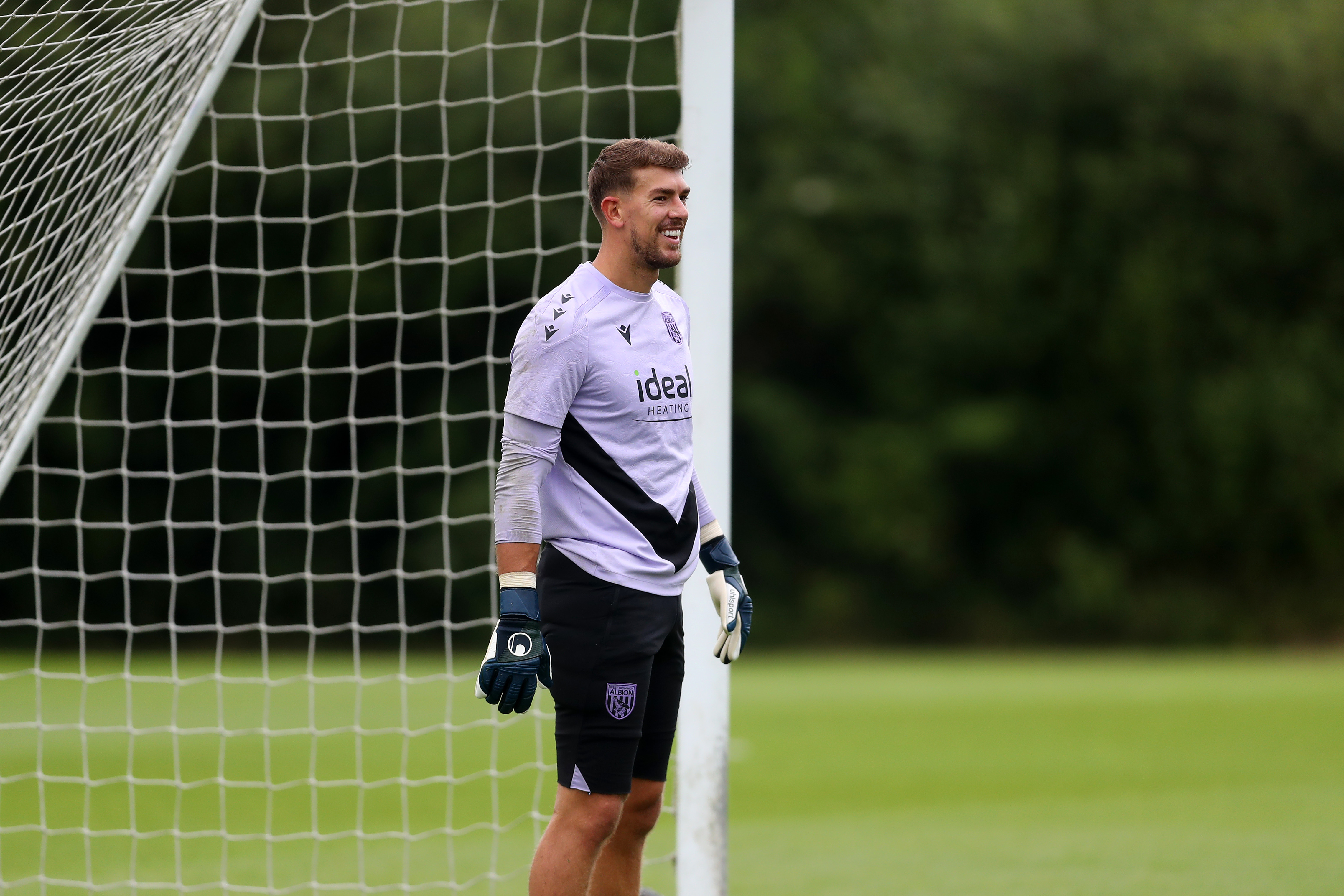 Alex Palmer smiling during a training session 