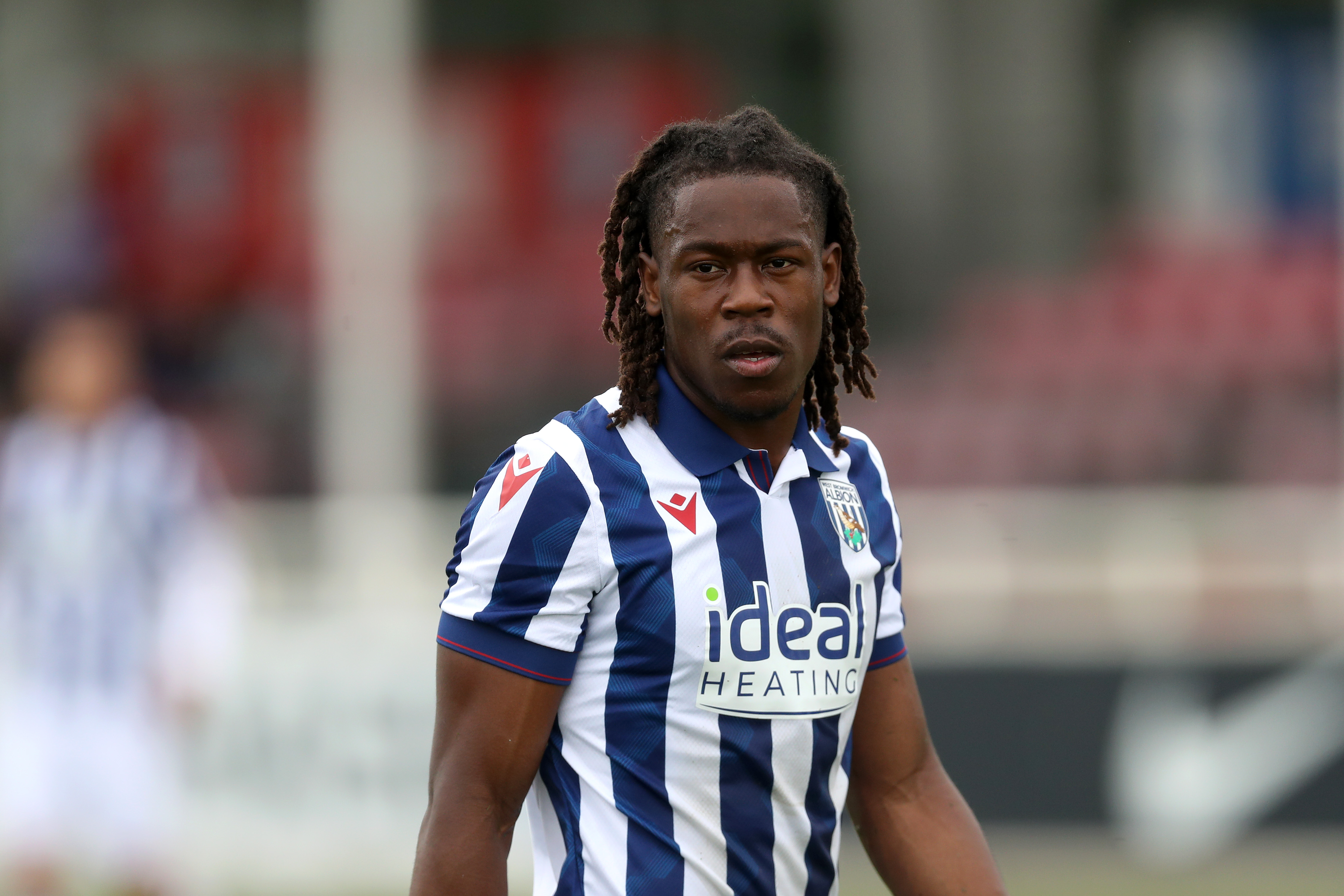 Brandon Thomas-Asante in action against Bolton in a friendly at St. George's Park wearing the home kit 