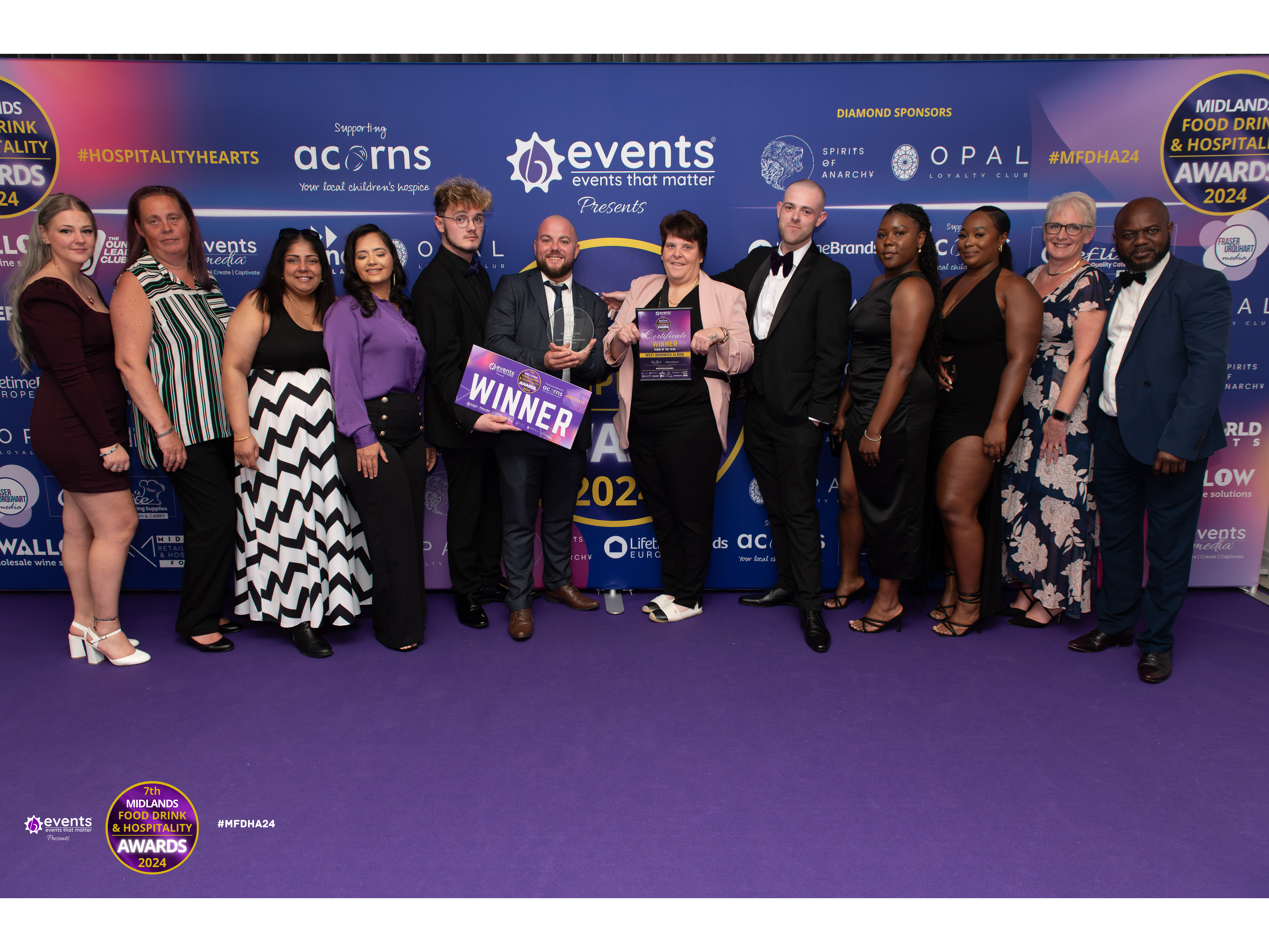 Members of WBA's Catering and Events Team up on stage receiving their award