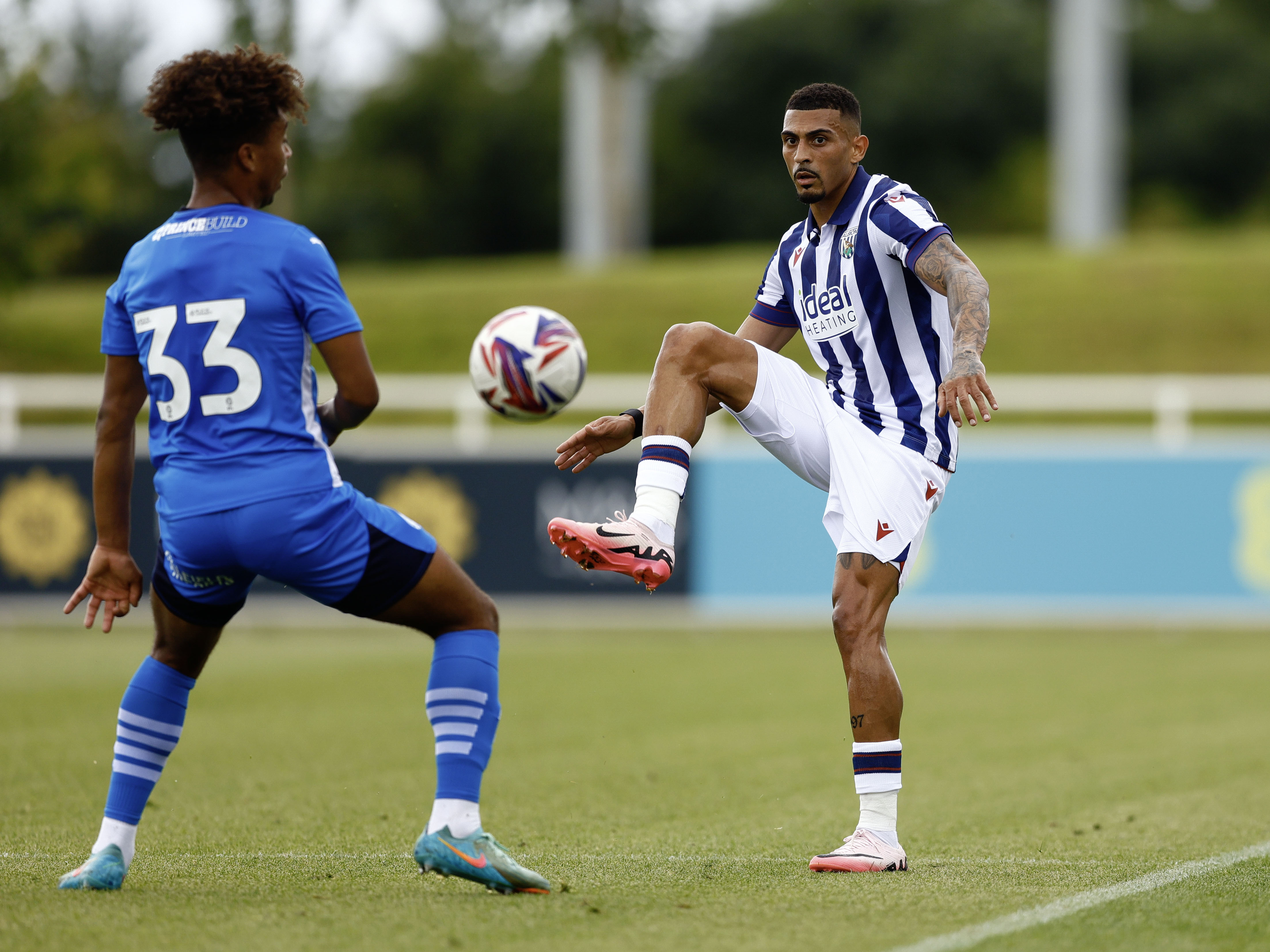 An image of Karlan Grant controlling a ball against Peterborough