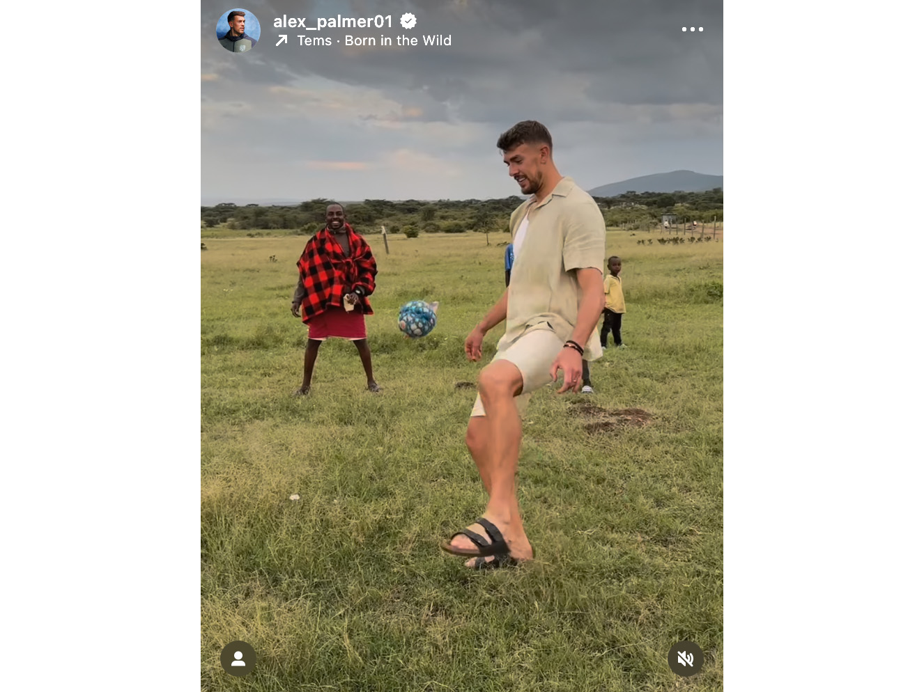 An image from Alex Palmer's Instagram of him playing football with people in a village in Kenya