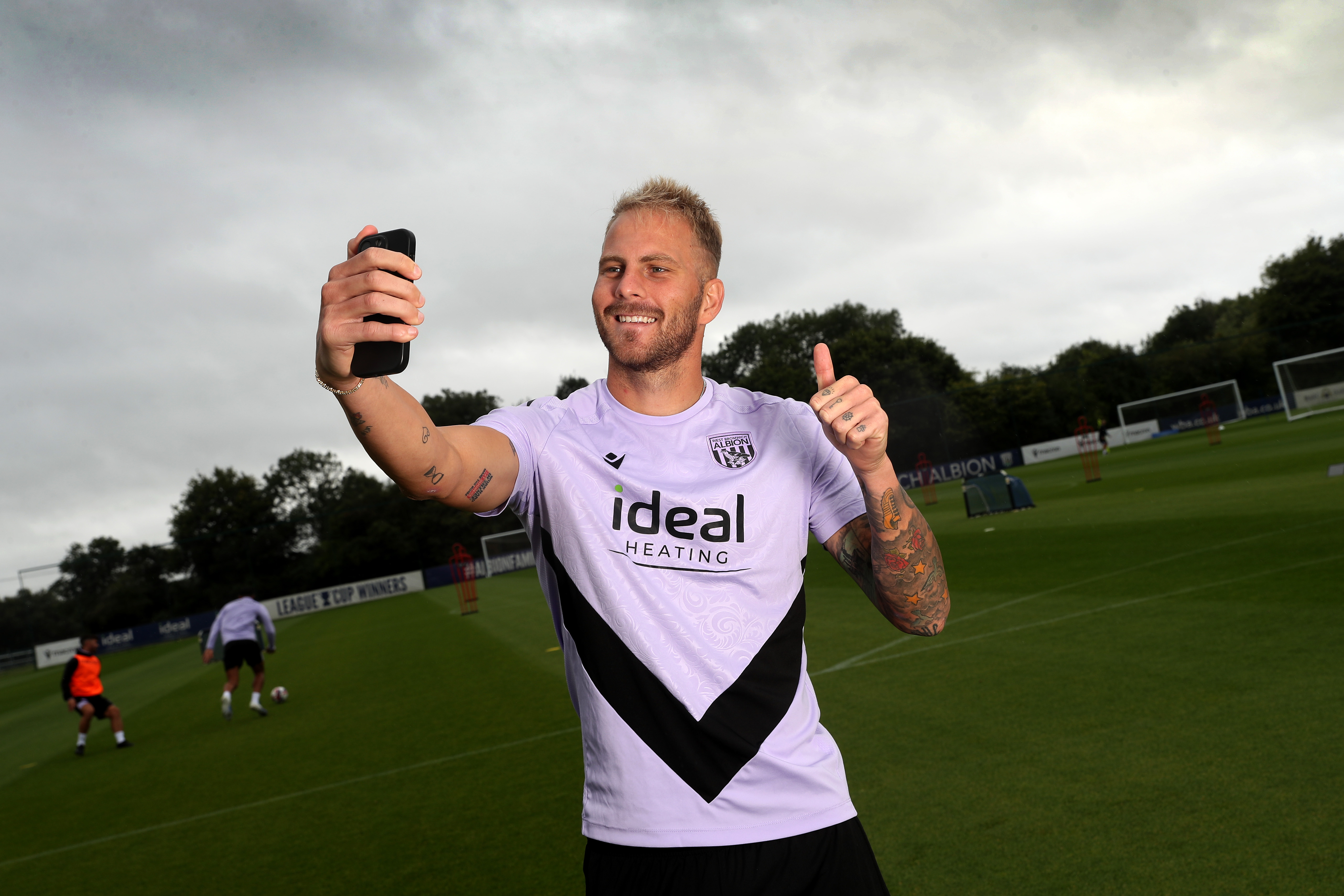 Uroš Račić takes a selfie out on a training pitch 