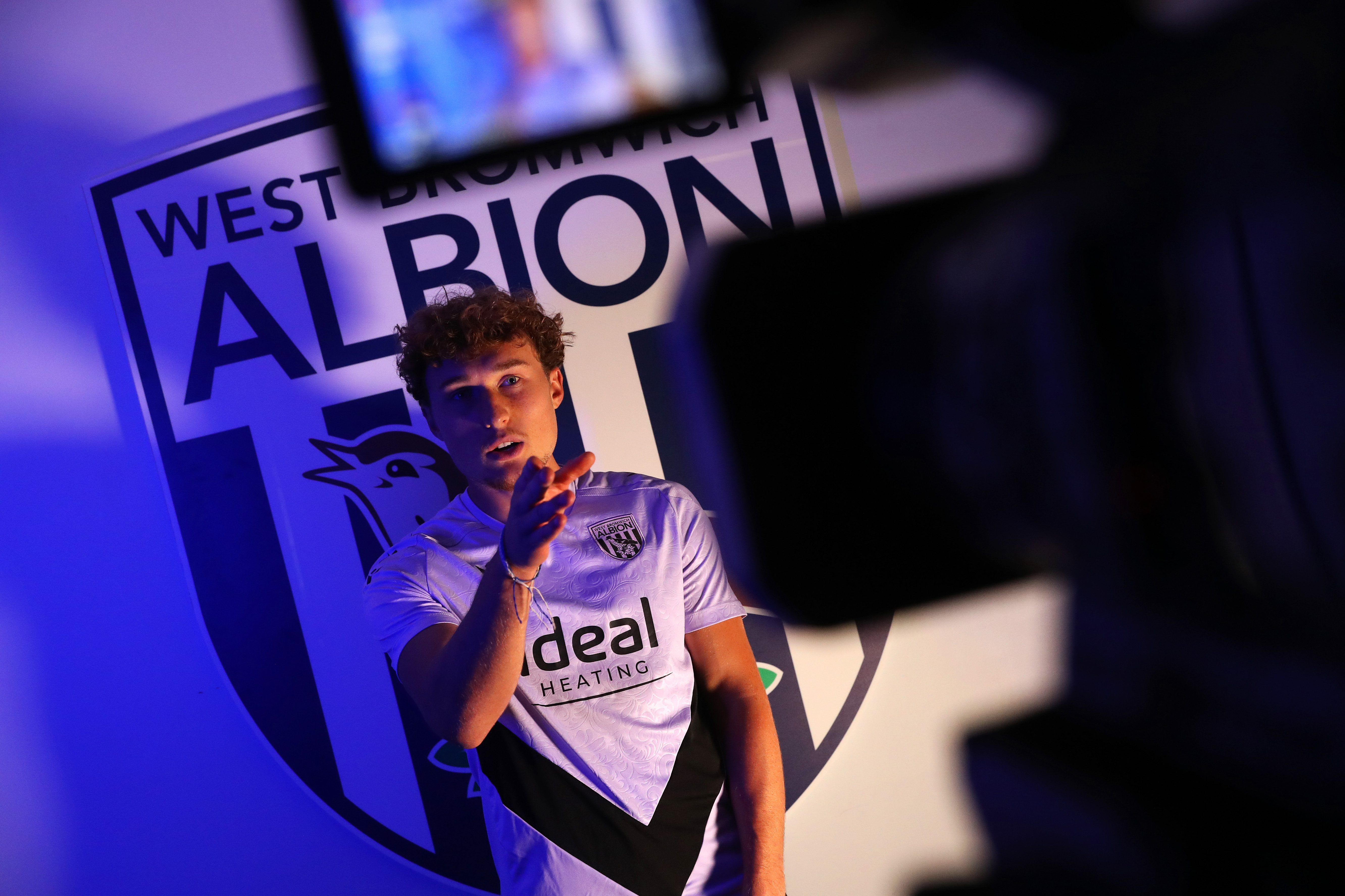 Callum Styles being interviewed in front of a WBA badge 