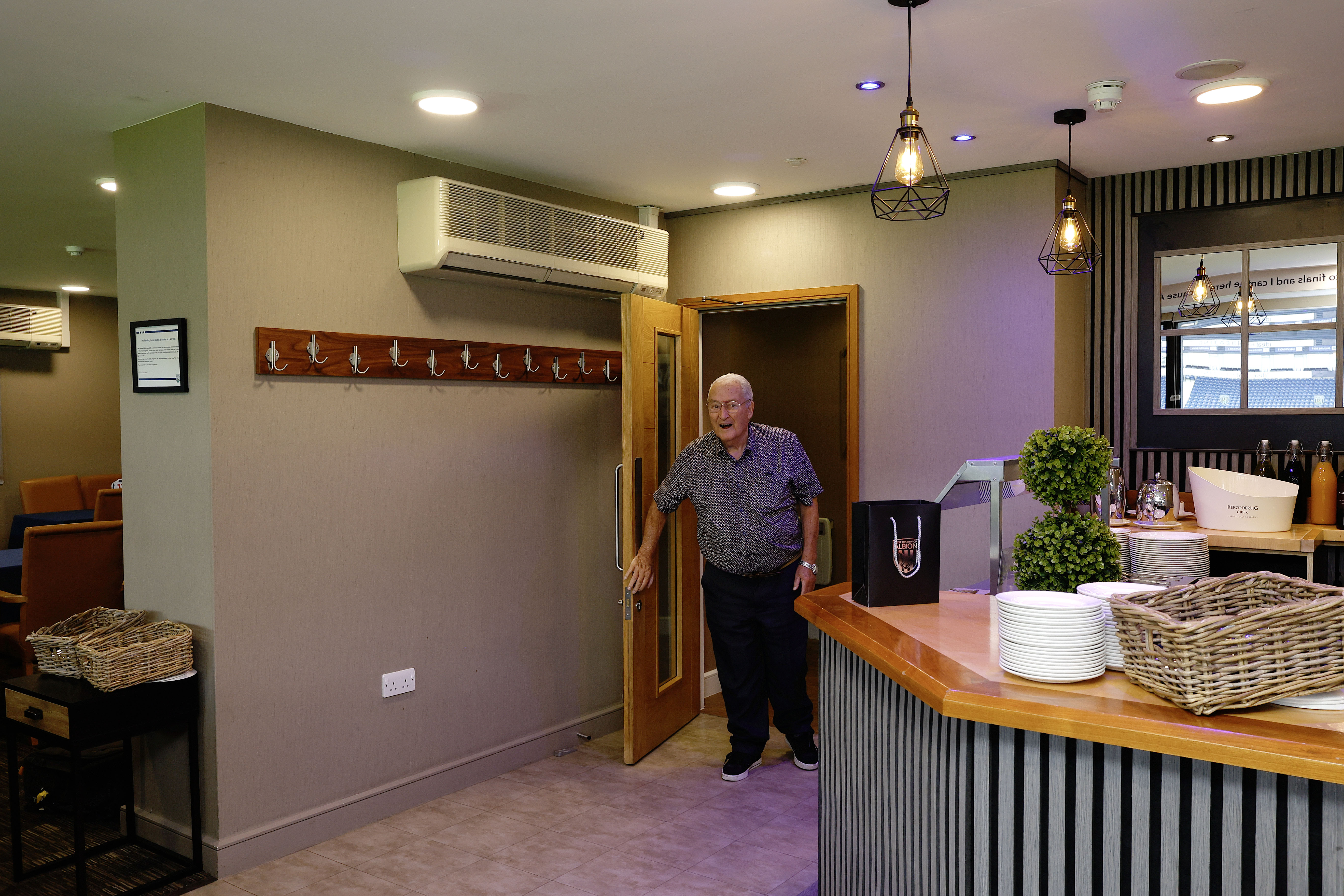 Graham Williams walks into the Graham Williams Suite at The Hawthorns