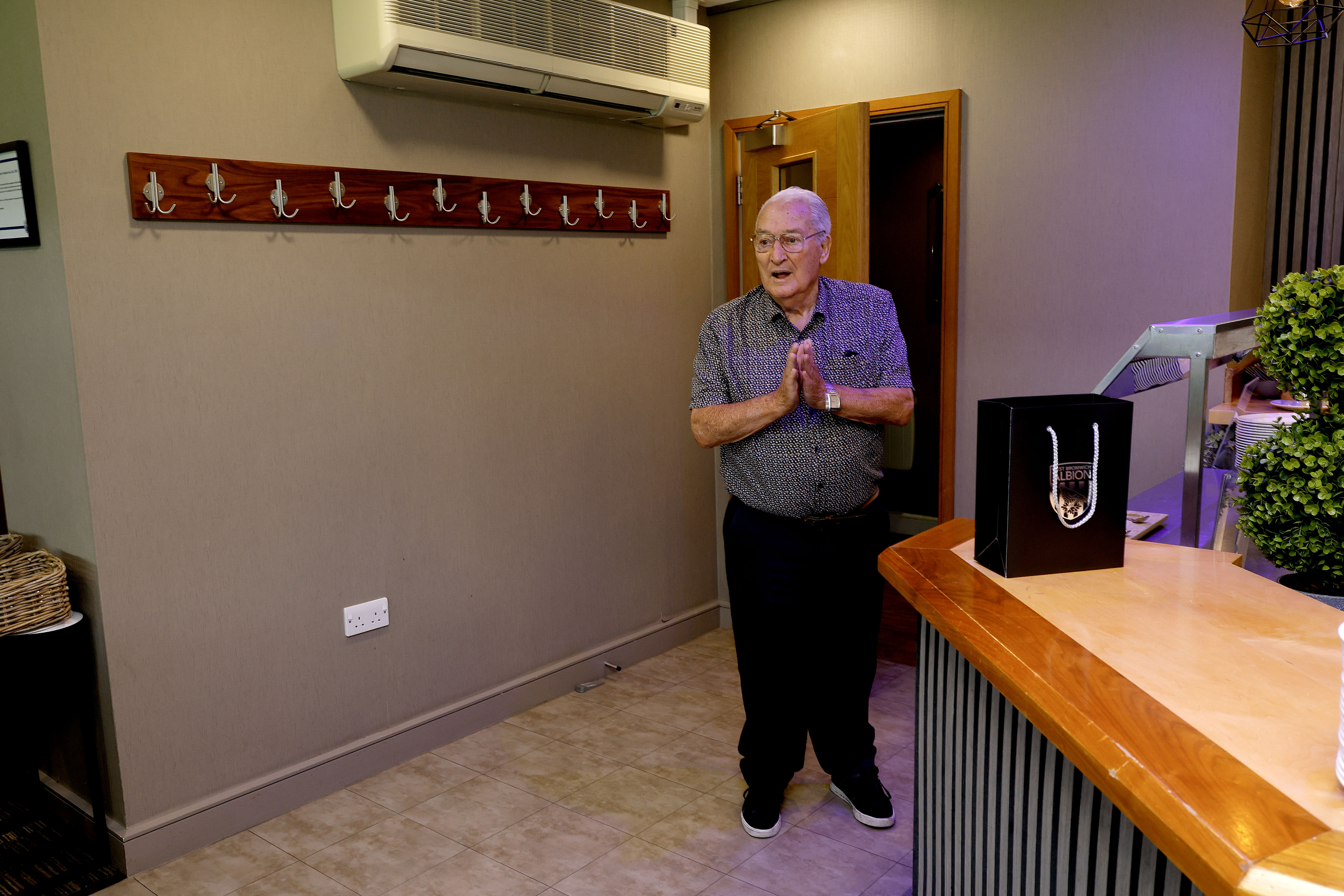 Graham Williams walks into the Graham Williams Suite at The Hawthorns