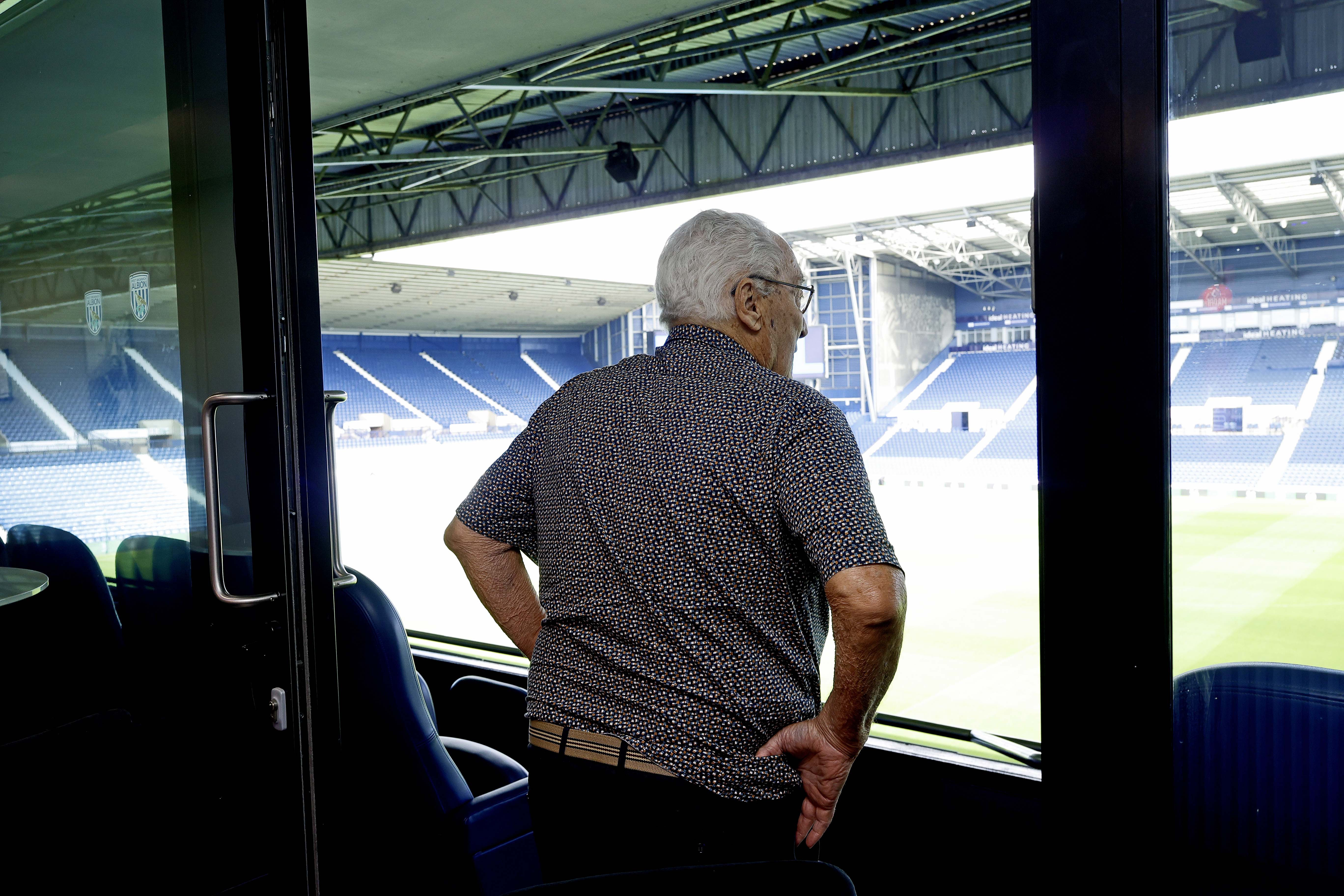 Graham Williams looking out on to the pitch from the Graham Williams Suite at The Hawthorns 