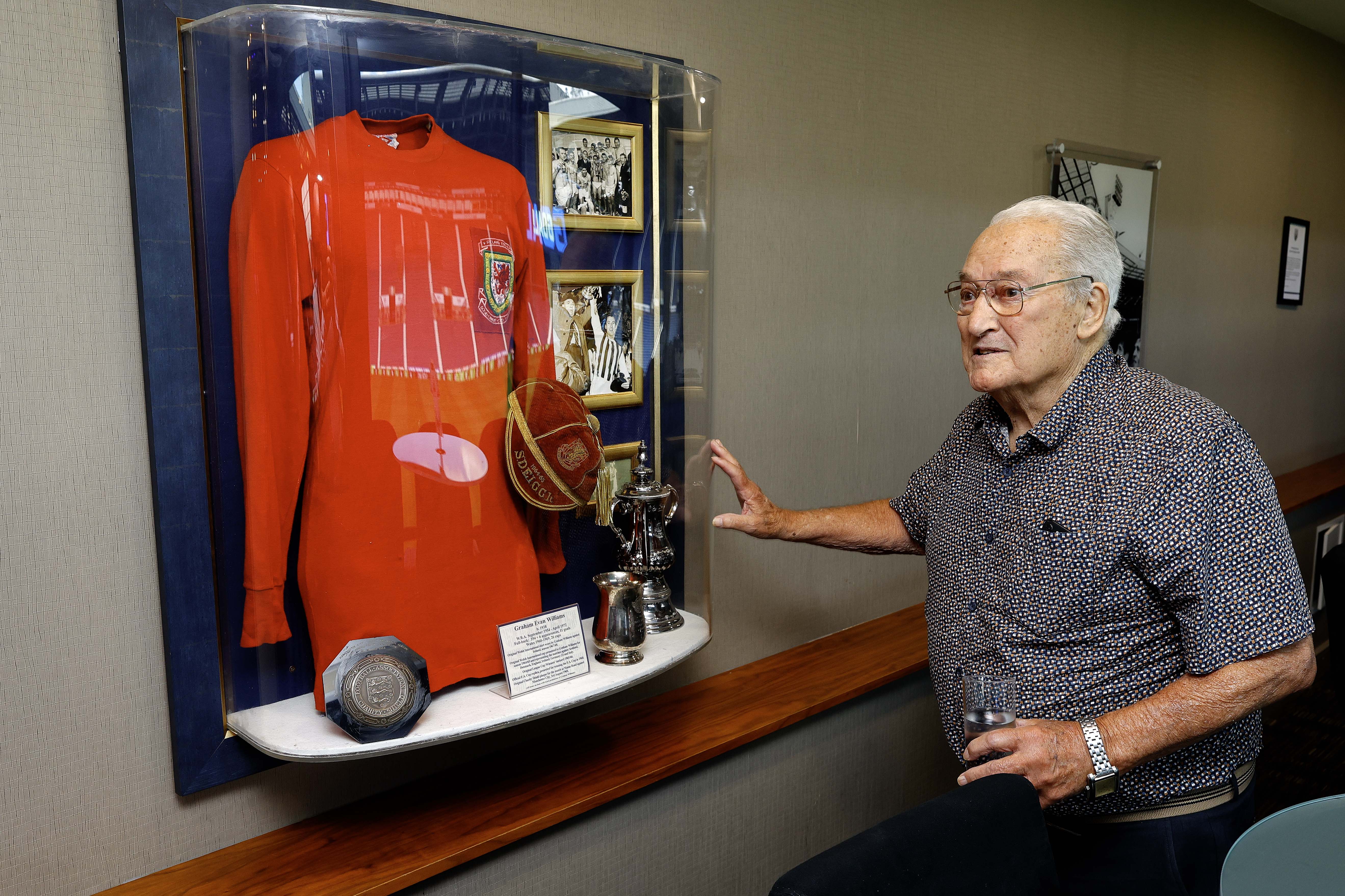 Graham Williams looking at a picture on the wall at The Hawthorns 