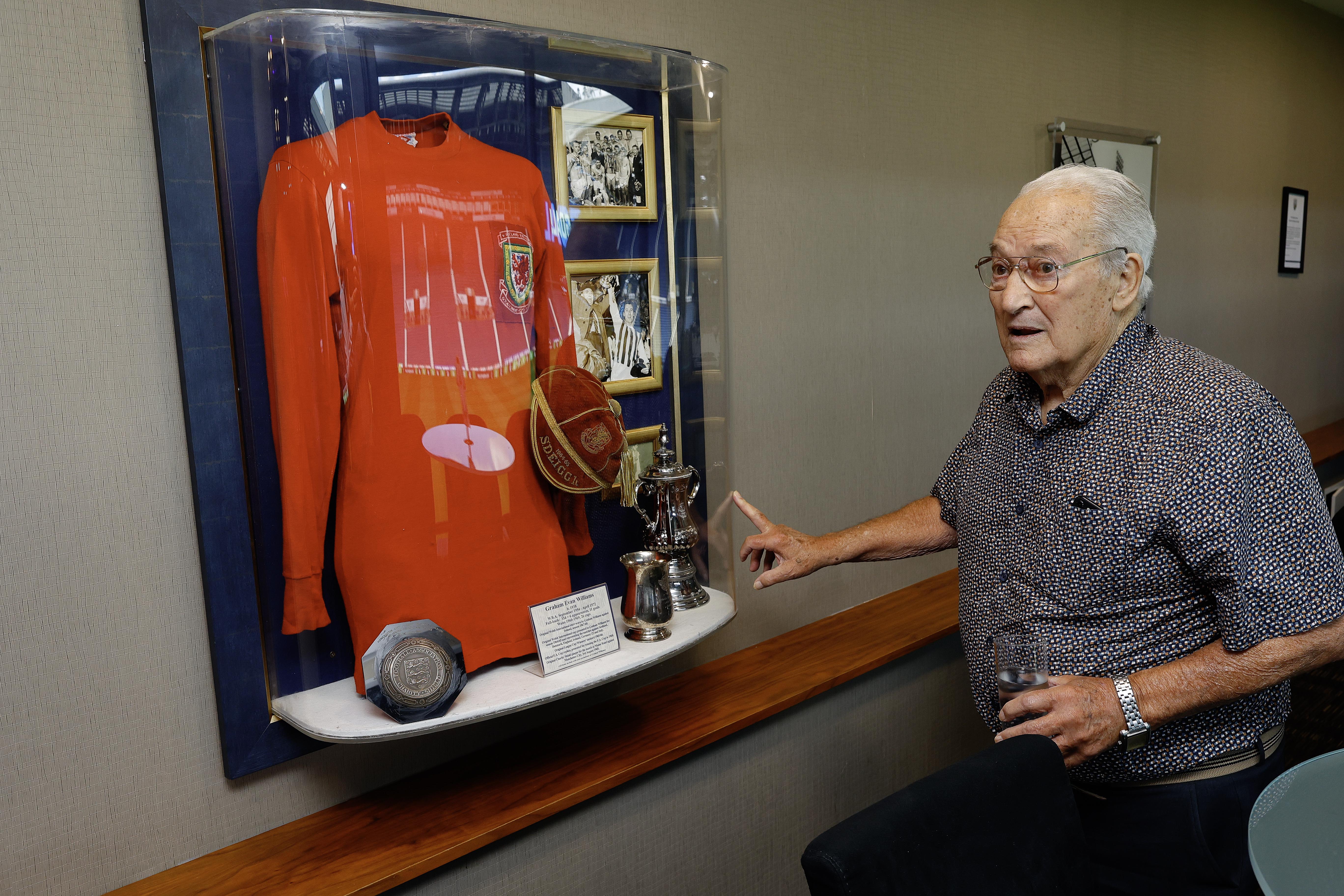 Graham Williams looking at a picture on the wall at The Hawthorns 