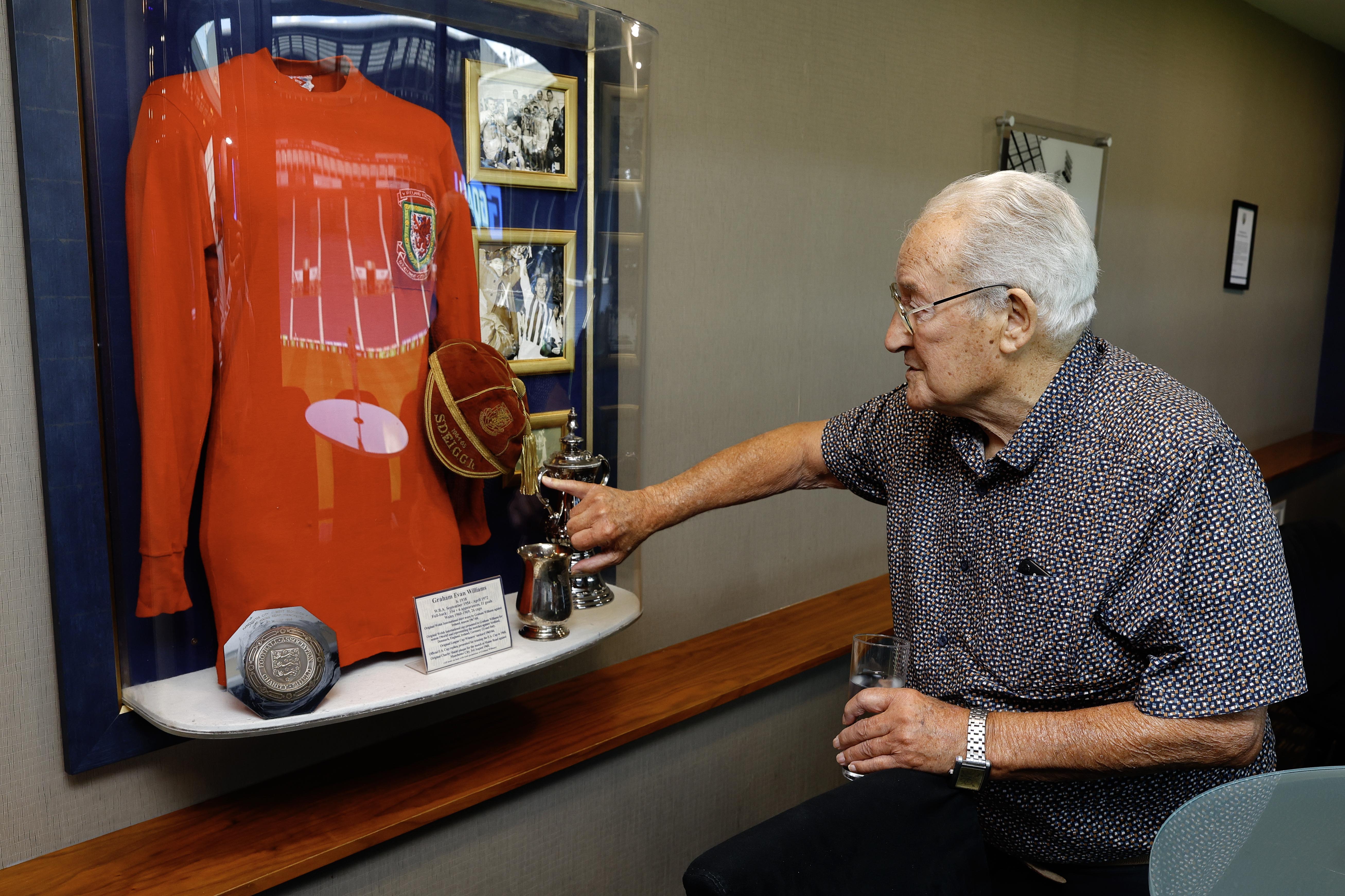 Graham Williams looking at a picture on the wall at The Hawthorns 