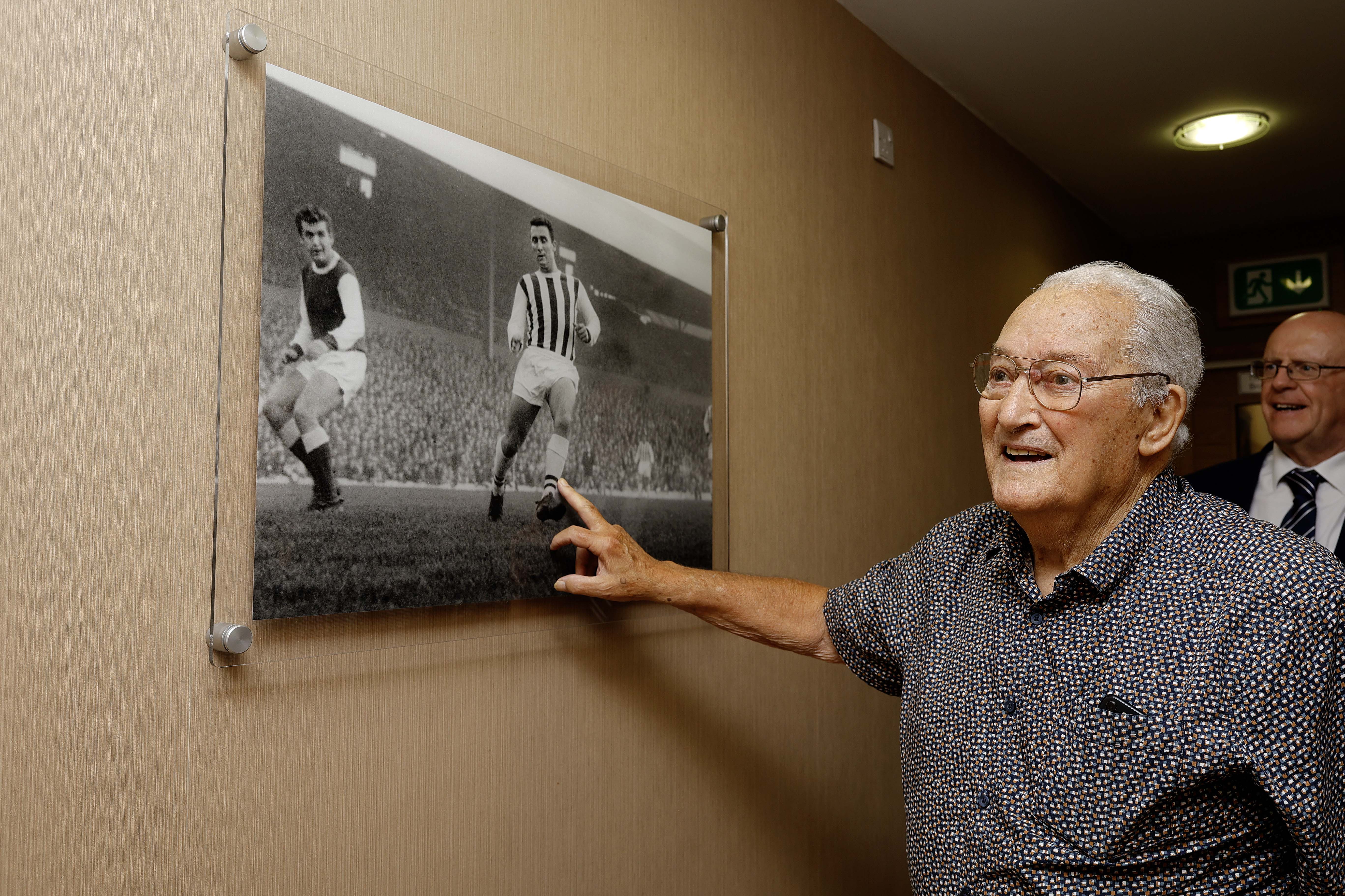 Graham Williams looking at a picture on the wall at The Hawthorns 