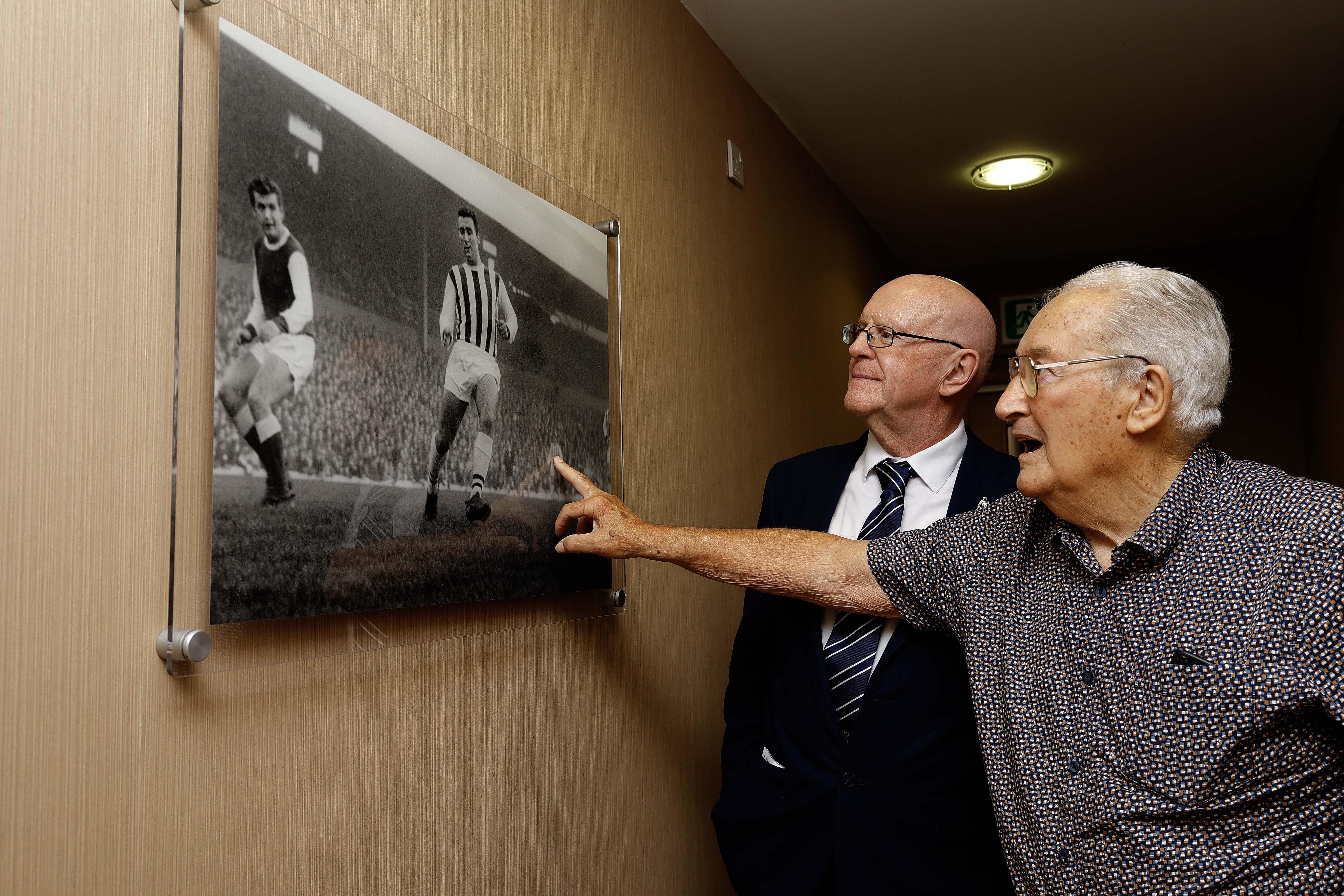 Graham Williams looking at a picture on the wall at The Hawthorns 