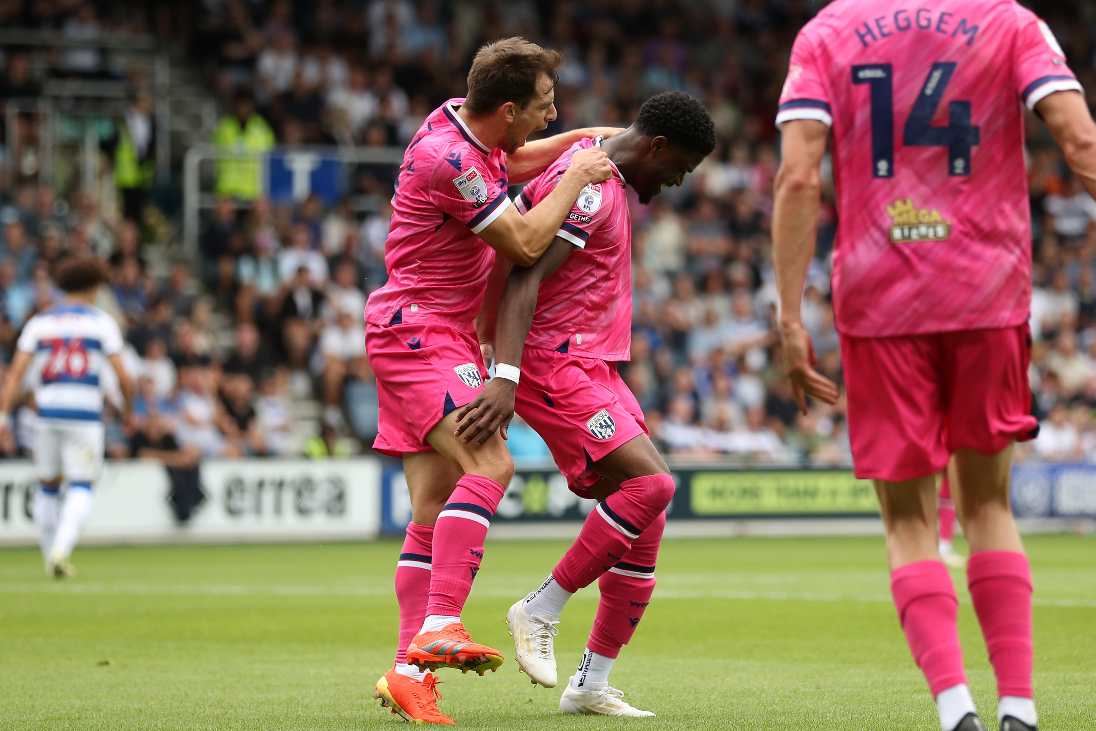 Josh Maja celebrates scoring his first goal at QPR with Jayson Molumby