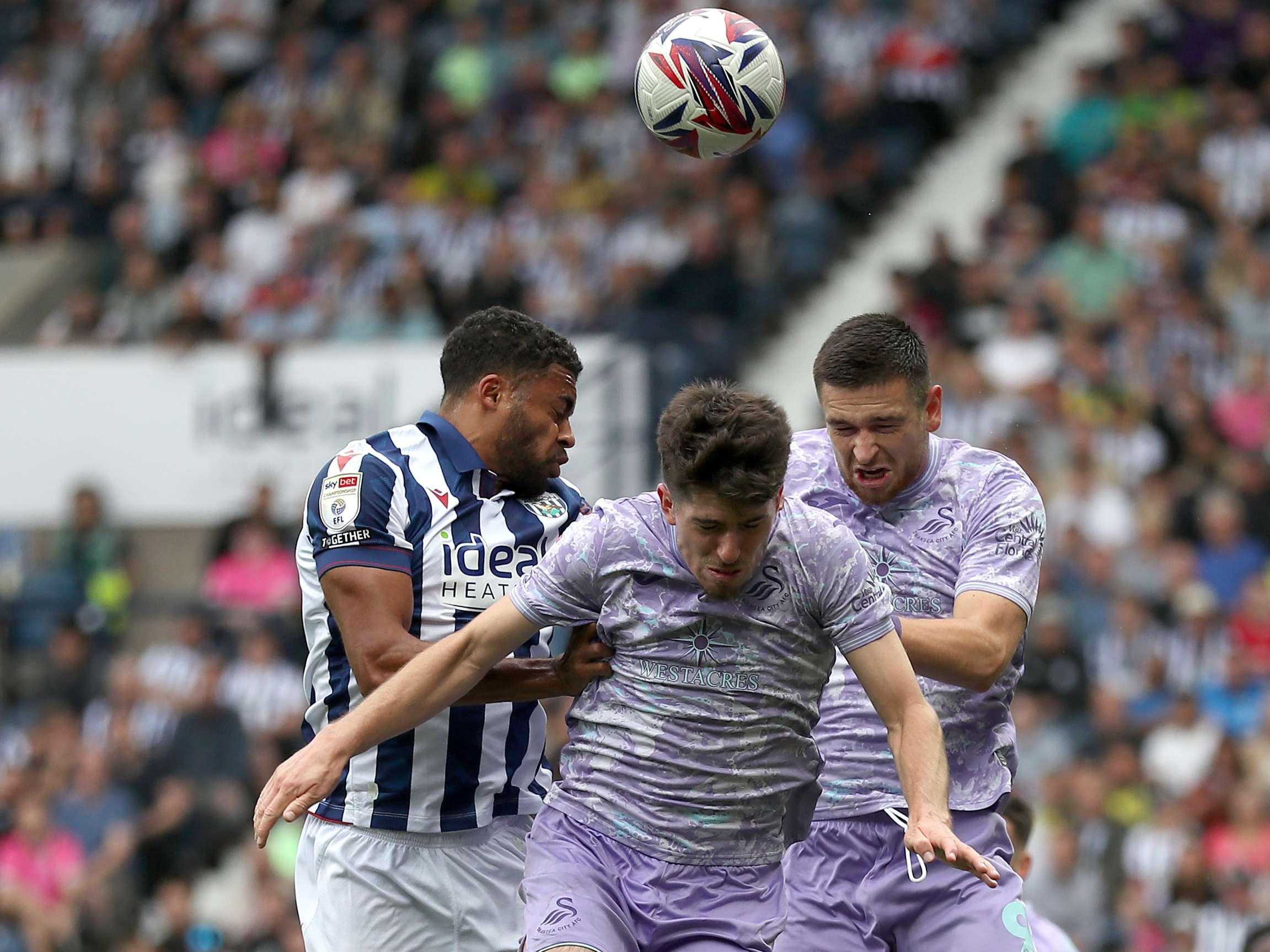 Darnell Furlong jumps to try and win a header against Swansea 