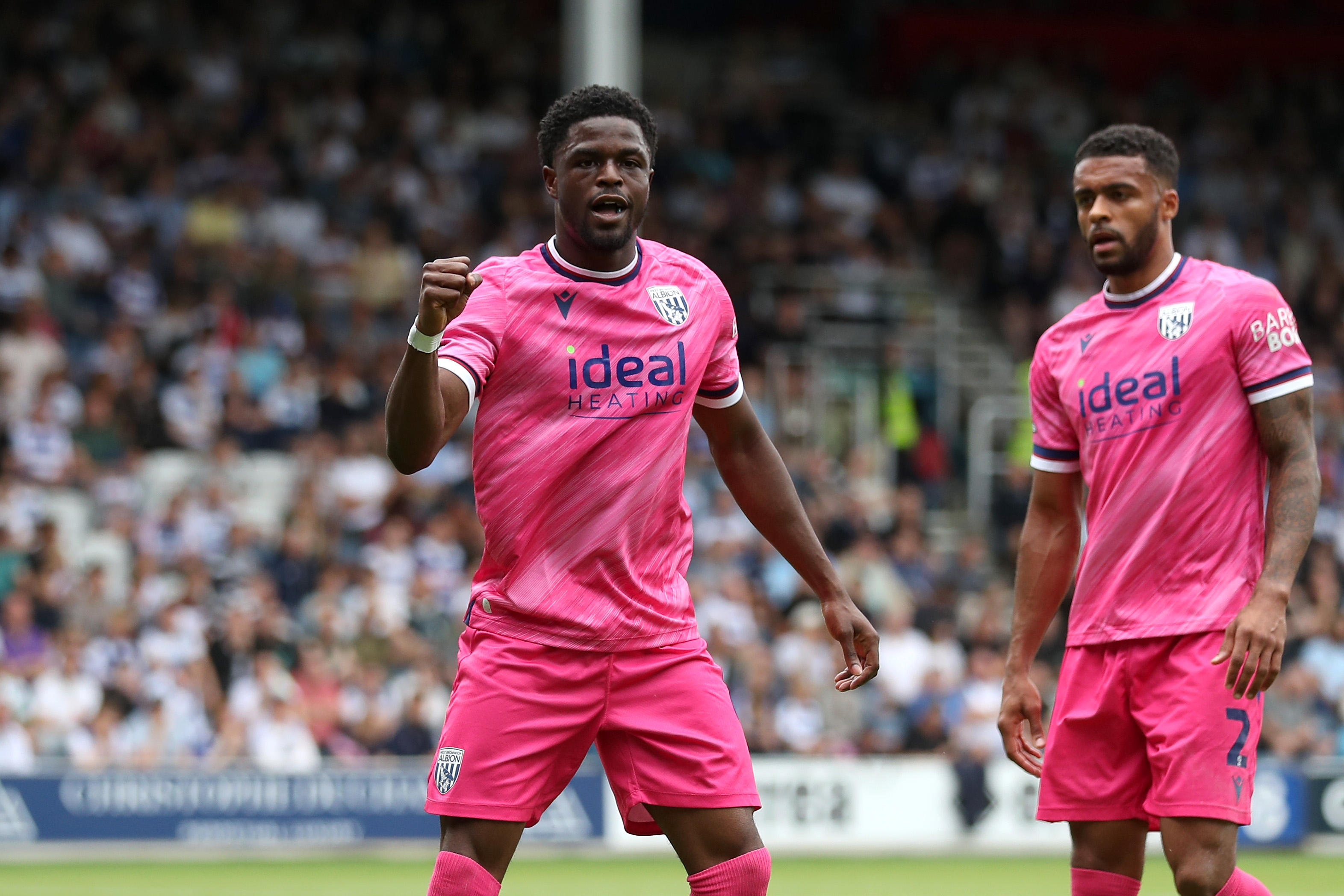 Josh Maja celebrates scoring his first goal at QPR with Darnell Furlong 