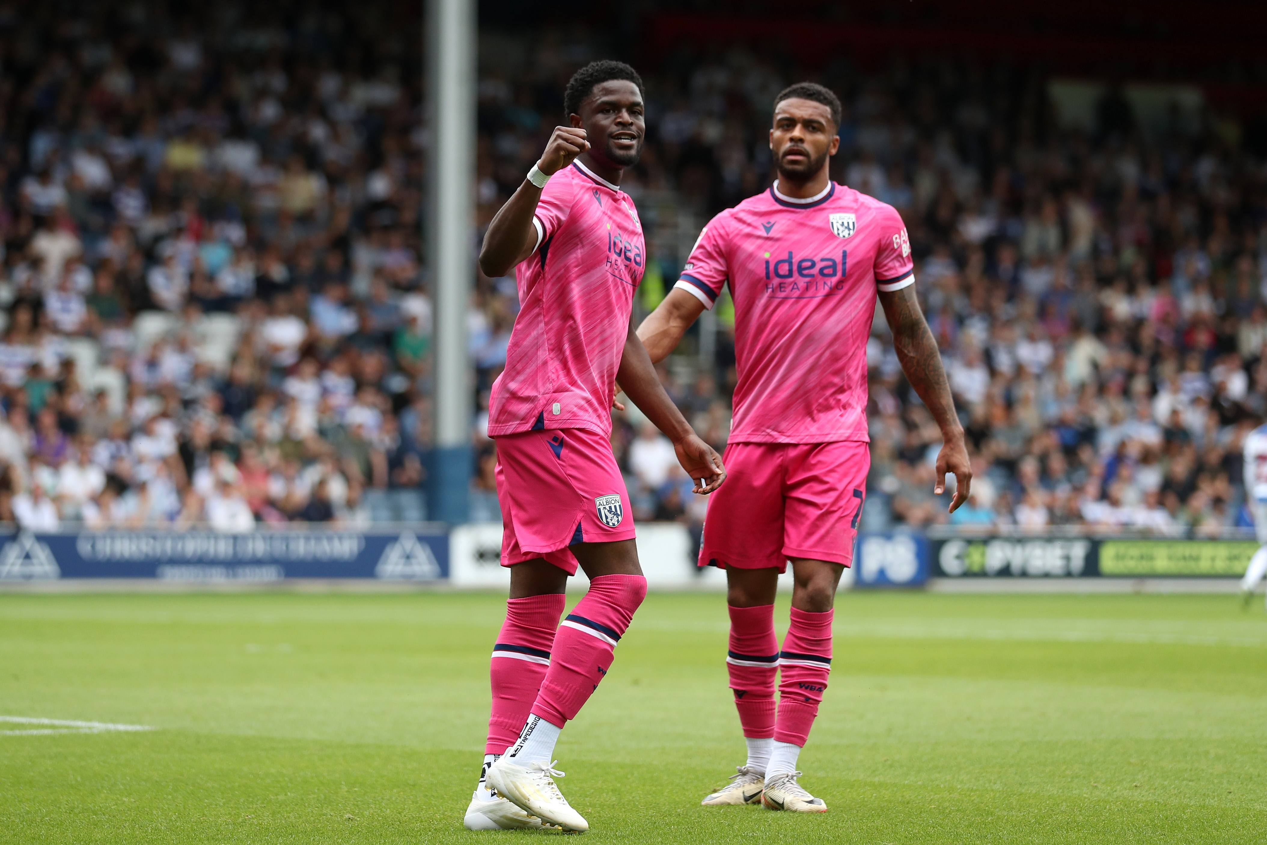 Josh Maja celebrates scoring his first goal at QPR with Darnell Furlong 