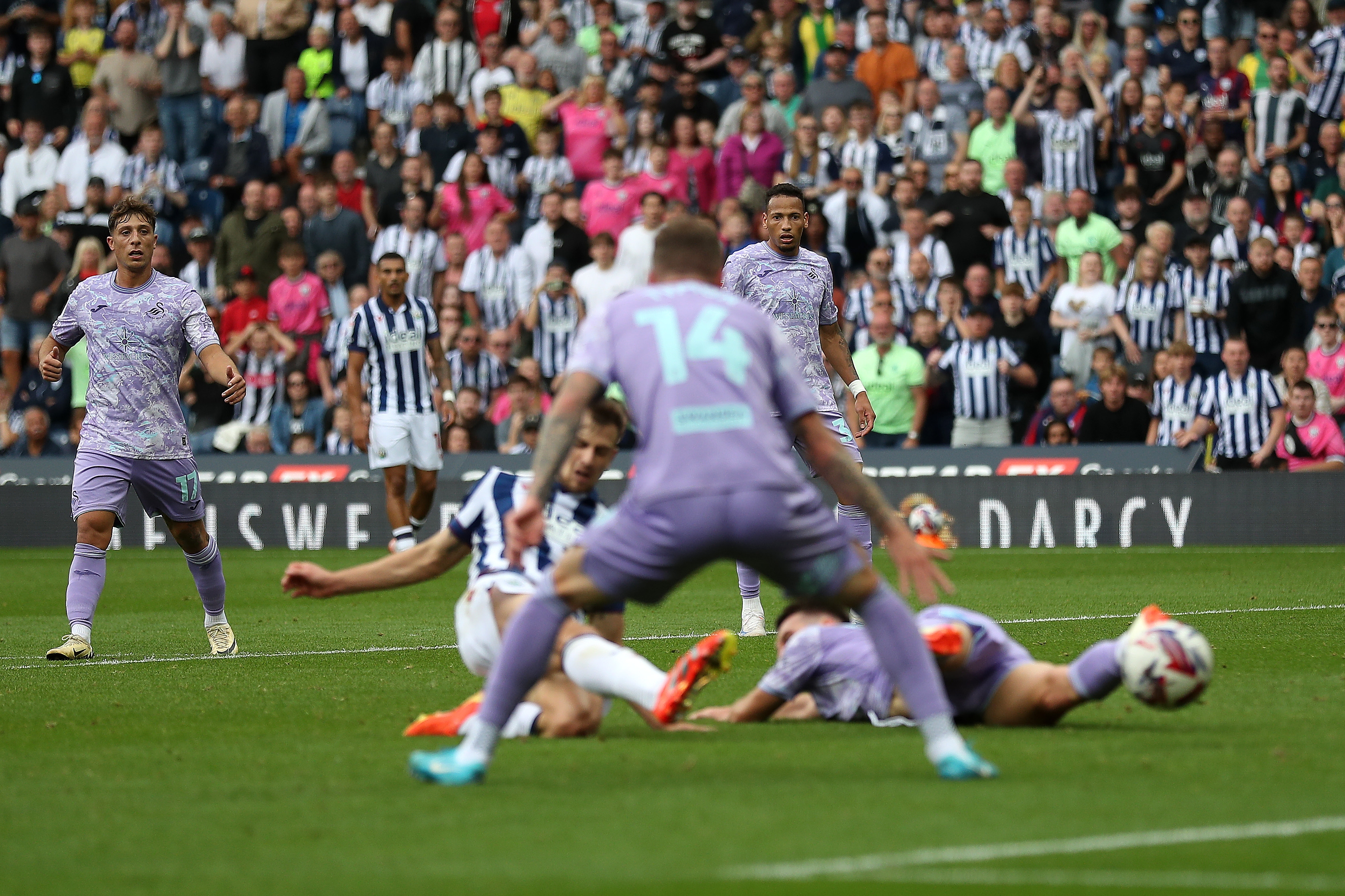 Jayson Molumby striking at goal against Swansea 