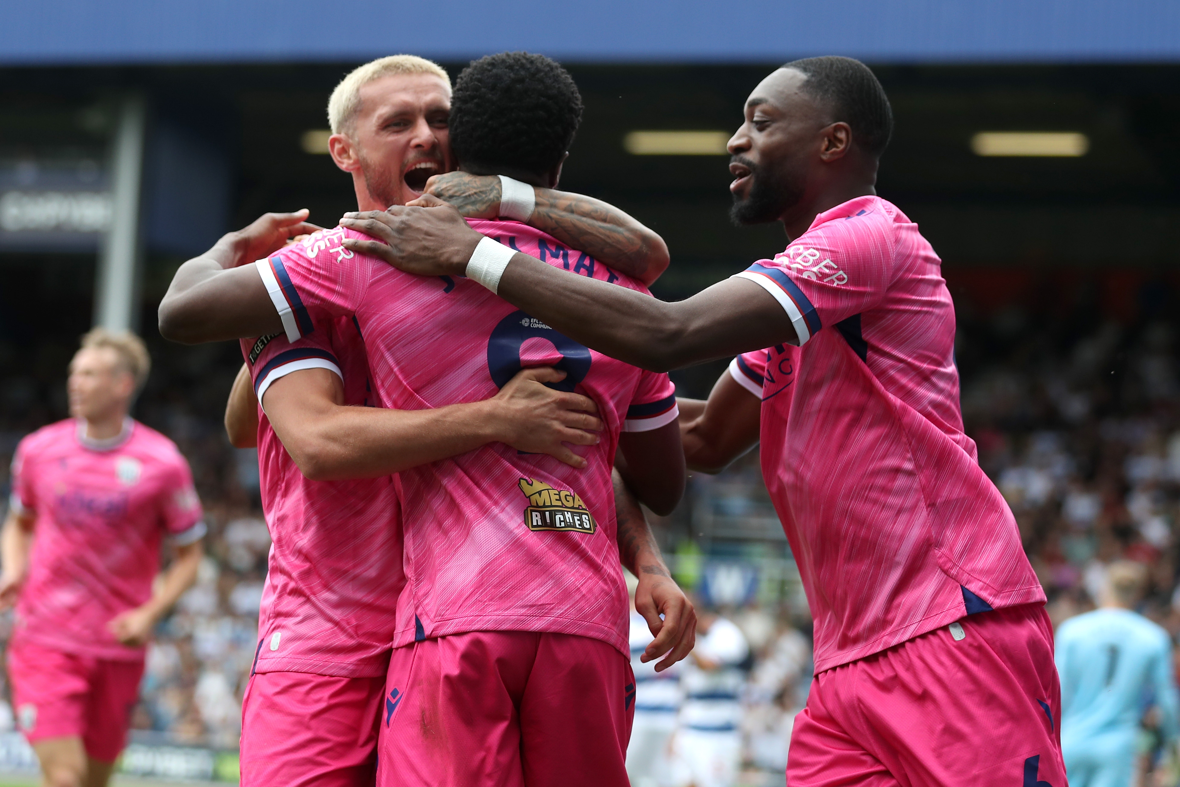 Josh Maja celebrates scoring his second goal at QPR with team-mates